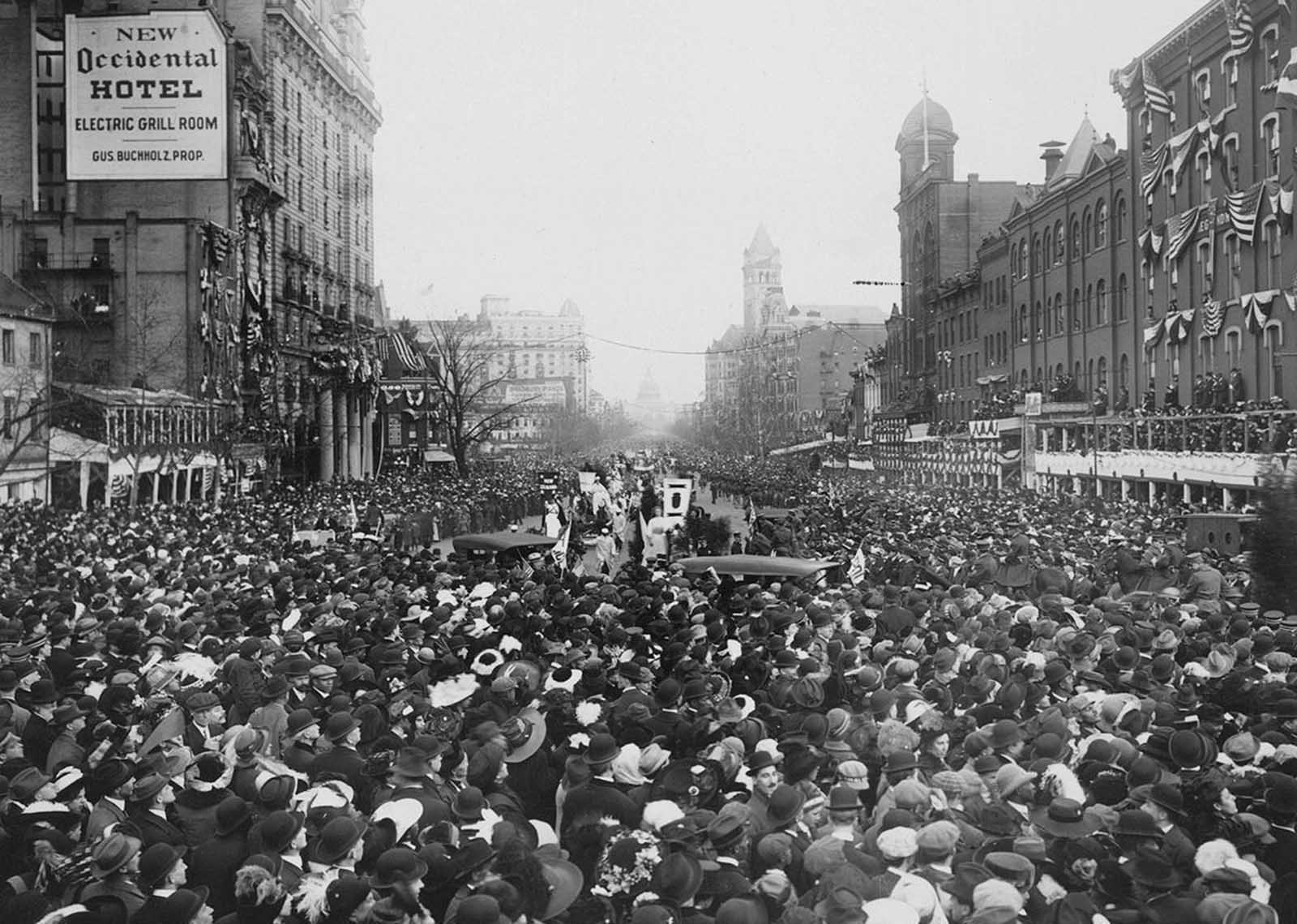 The crowd converges on marchers, blocking the parade route during March 3, 1913, suffrage procession, in Washington, District of Columbia.
