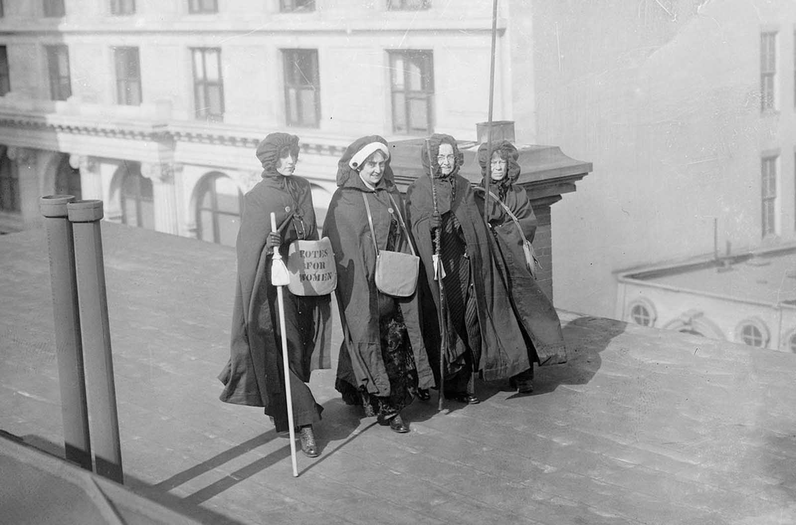 After the Parade: Mrs. John Boldt, Mrs. May Morgan, Miss Dock, and Miss Craft, suffrage hikers who took part in the suffrage hike from New York City to Washington, District of Columbia, as well as the parade itself, on March 3, 1913.