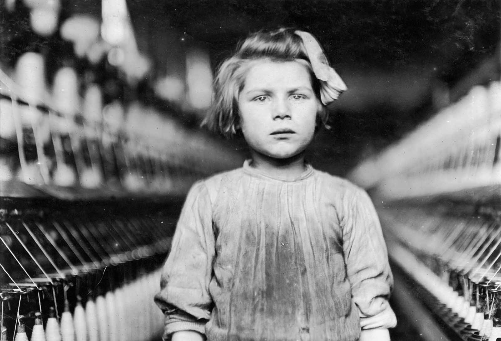 A spinner in the Globe Cotton Mill in Augusta, Georgia, in January of 1909. The overseer admitted she was regularly employed.