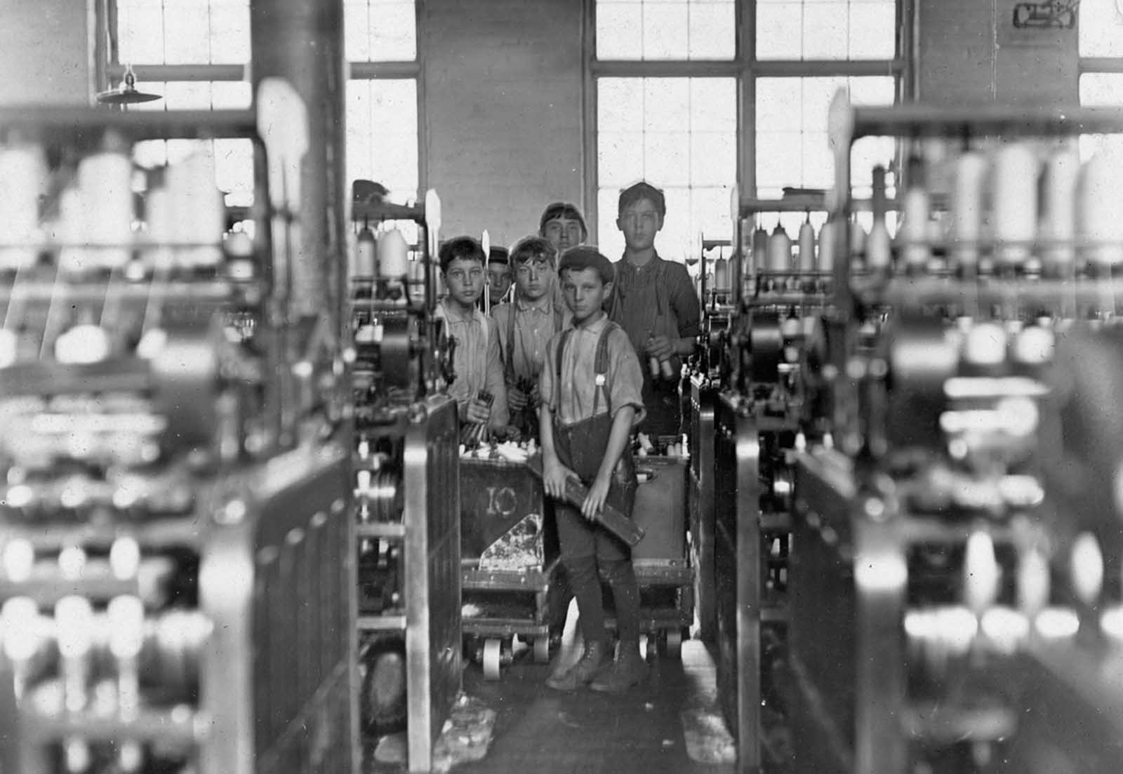 Young doffers in Mollahan Mills in Newberry, South Carolina, on December 3, 1908. A doffer is someone who removes, or