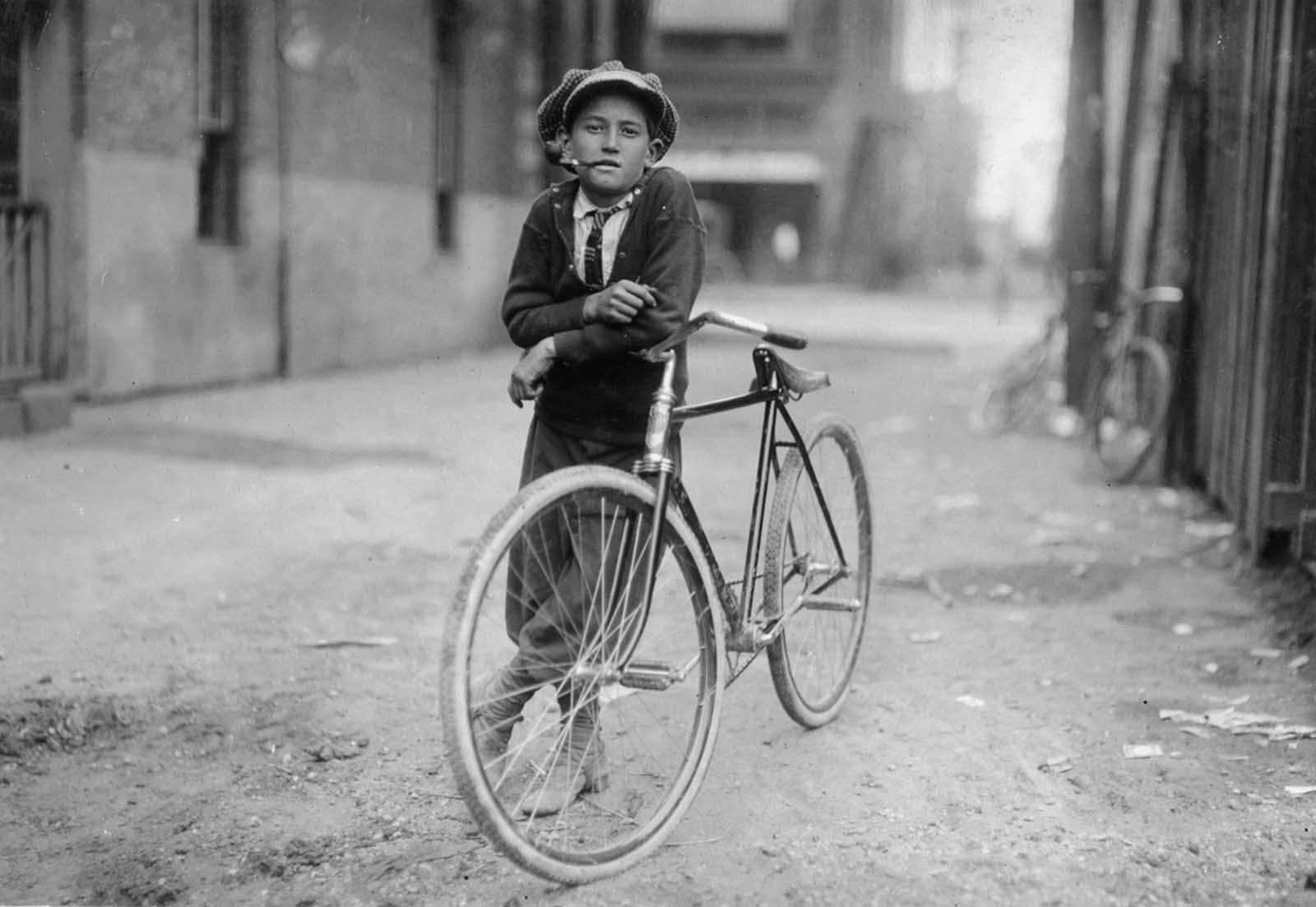 A pipe-smoking messenger boy working for Mackay Telegraph Company. He said he was fifteen years old. Photographed in Waco, Texas in September of 1913.