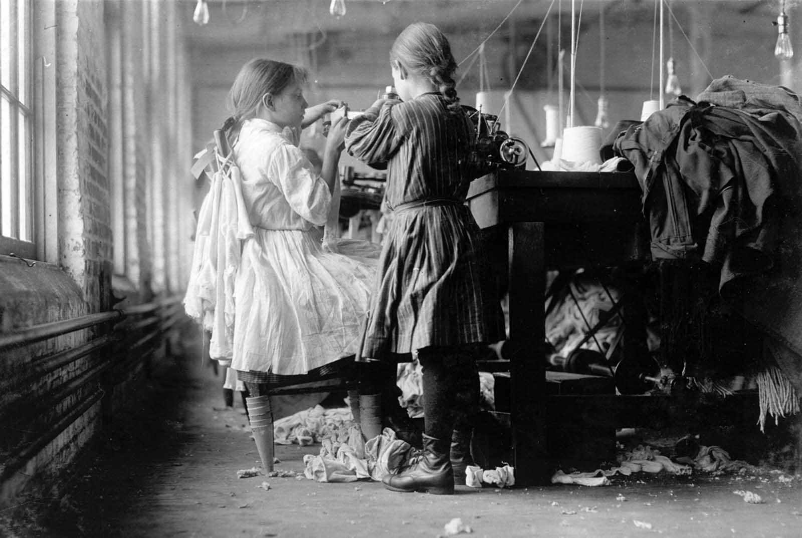 Two young workers, a raveler and a looper, in Loudon Hosiery Mills in Loudon, Tennessee, in December of 1910.