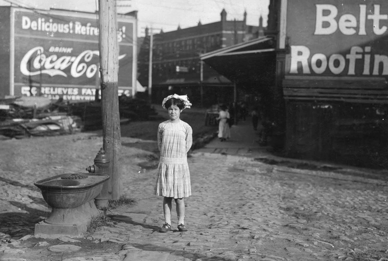 Ethel Shumate has been rolling cigarettes in a Danville Virginia factory for six months. She said she was thirteen years old, but it is doubtful. Photographed in June of 1911.