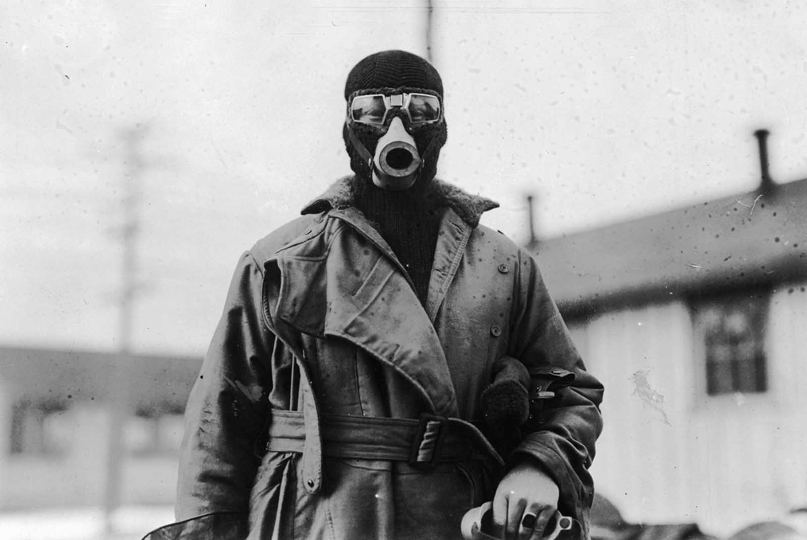 Unidentified pilot wearing a type of breathing apparatus. Image taken by O.I.C Photographic Detachment, Hazelhurst Field, Long Island, New York.