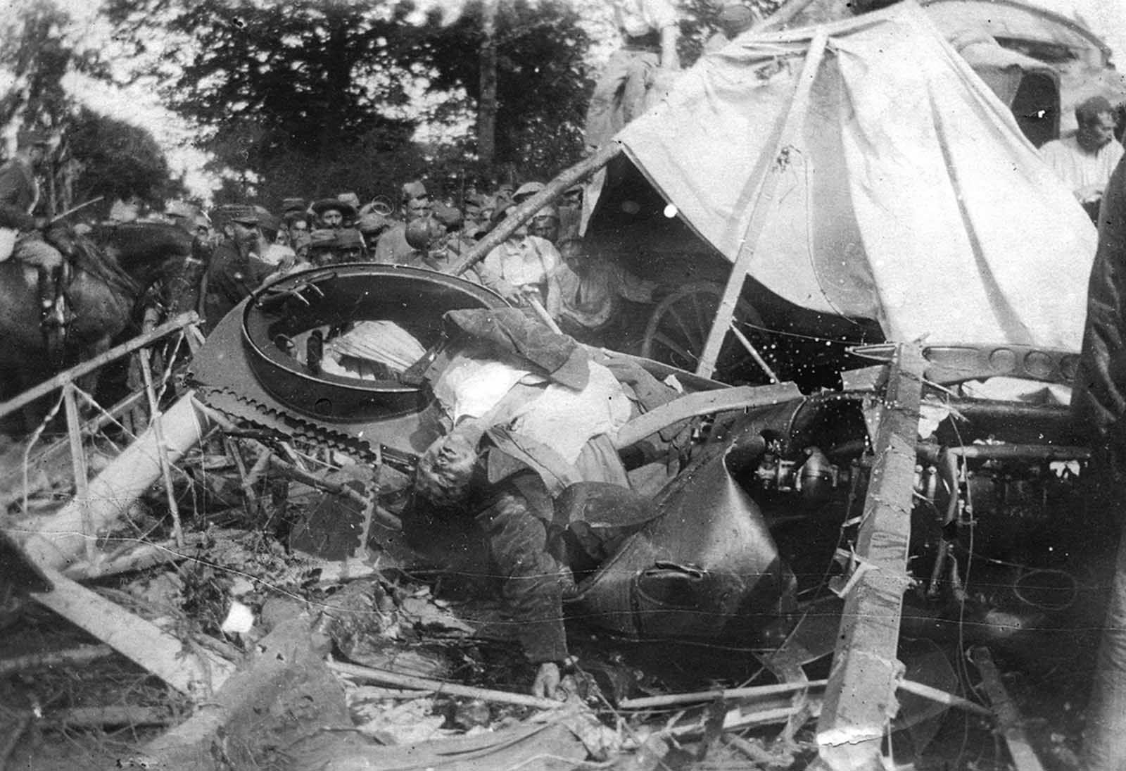 A German pilot lies dead in his crashed airplane in France, in 1918.