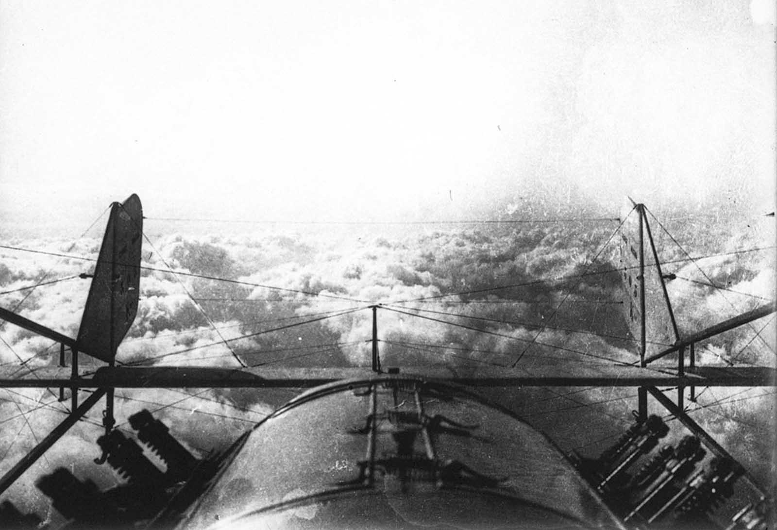 Returning from a reconnaissance flight during World War I, a view of the clouds from above.
