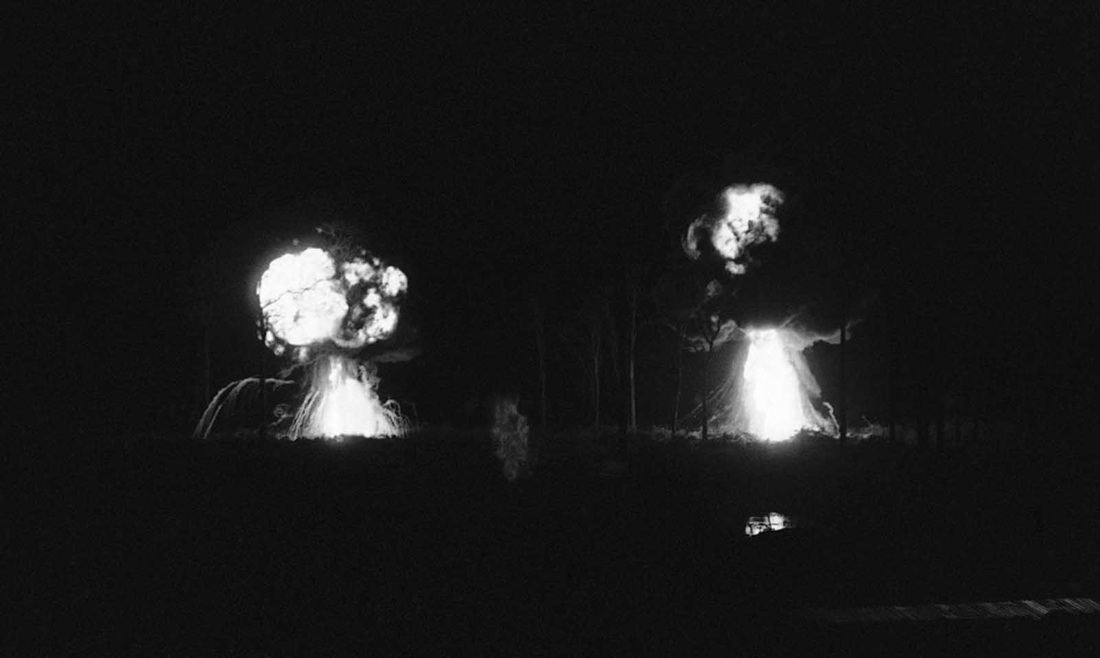 Two napalm drops explode just outside Katum, a U.S. Special Forces camp about 60 miles northwest of Saigon on August 28, 1968. The napalm was used when Viet Cong attacked the camp.