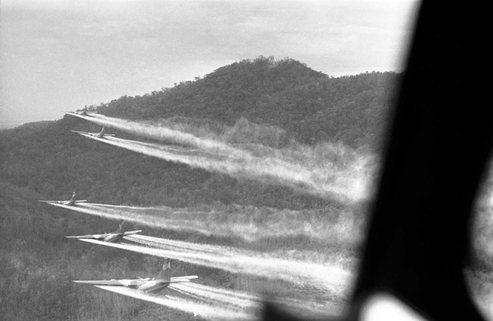 Flying 100 feet above the jungle hills west of Hue, five bulky C-123