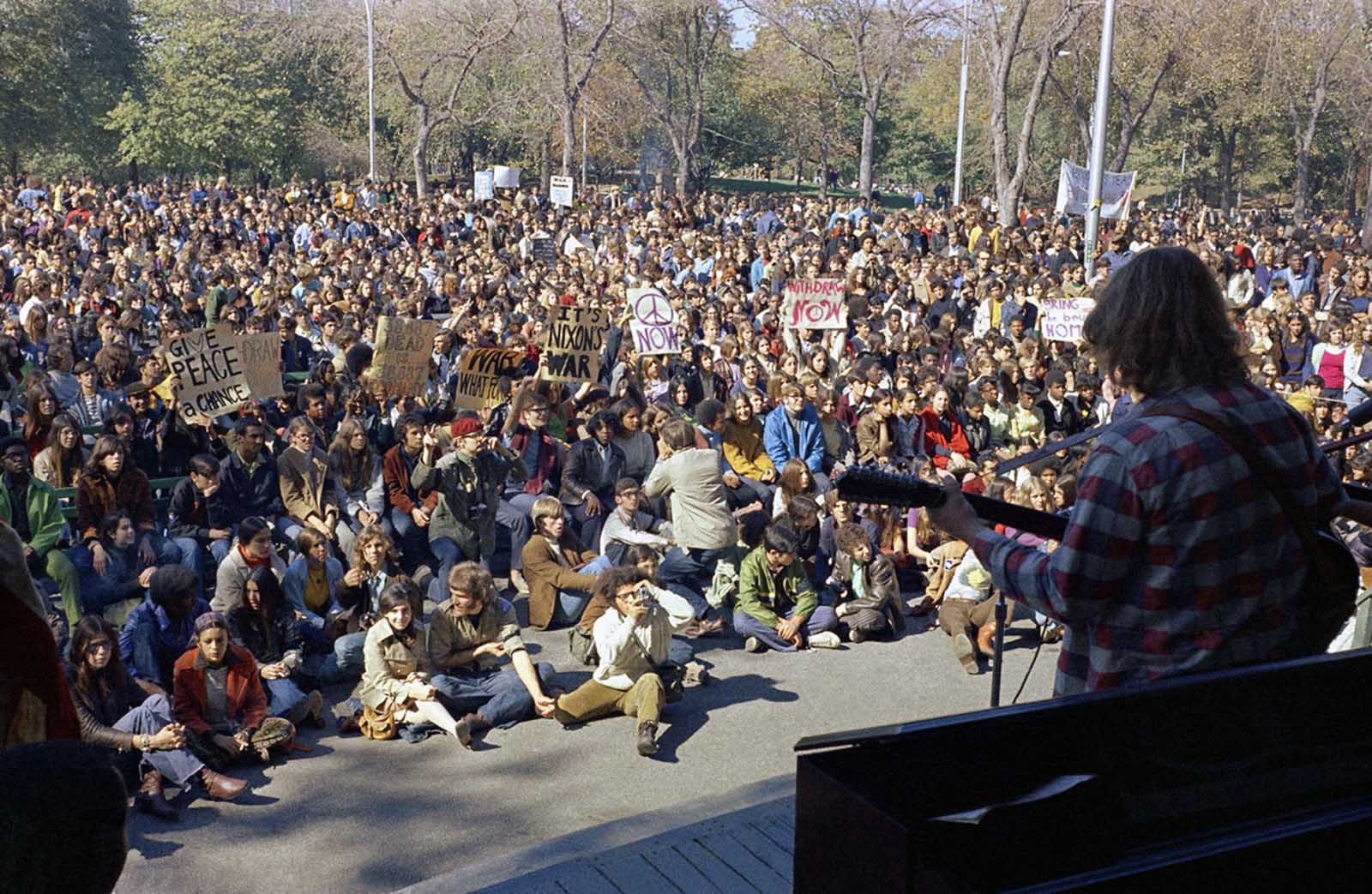 Demonstrators listen to a performer in Central Park on Moratorium Day, October 15, 1969. Moratorium Day was a mass demonstration and teach-in staged across the United States, in protest against continued American involvement in Vietnam.