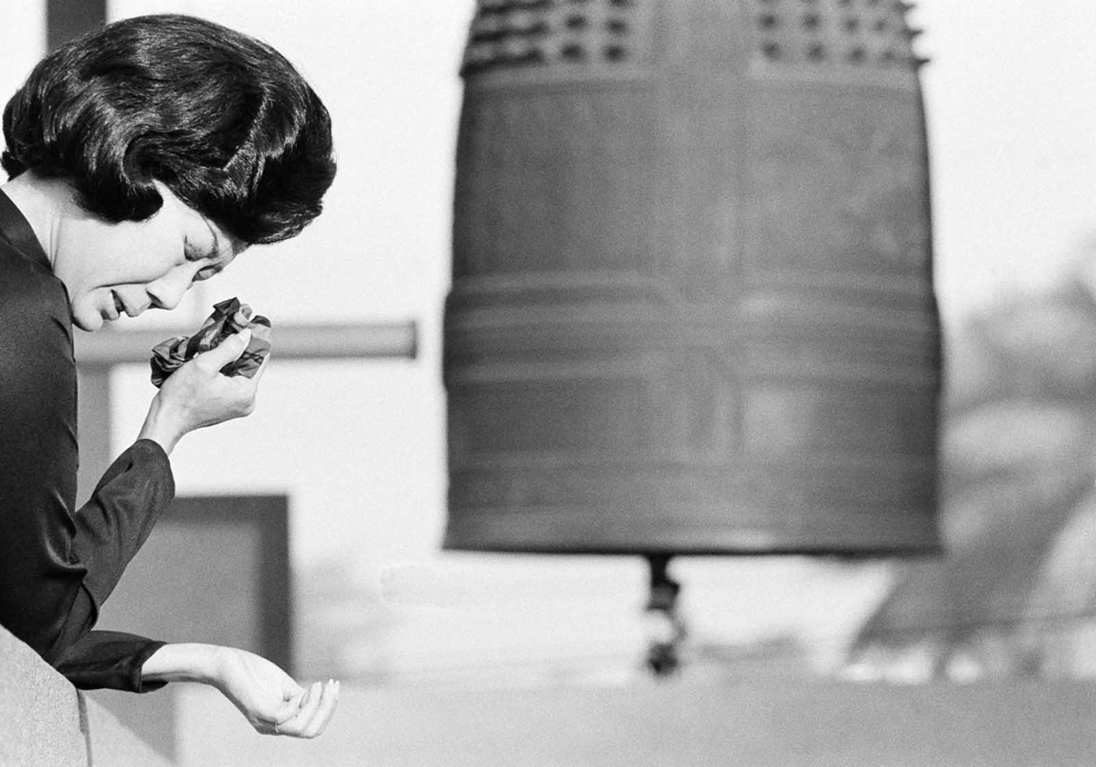 A South Vietnamese widow cries as a bell at a Saigon Buddhist pagoda tolls the ceasefire at 8 a.m., on Sunday, January 28, 1973, Saigon time. The United States had begun drastically reducing forces in the country, and, following the Paris Peace Accords of 1973, the last remaining American troops withdrew in March of 1973.