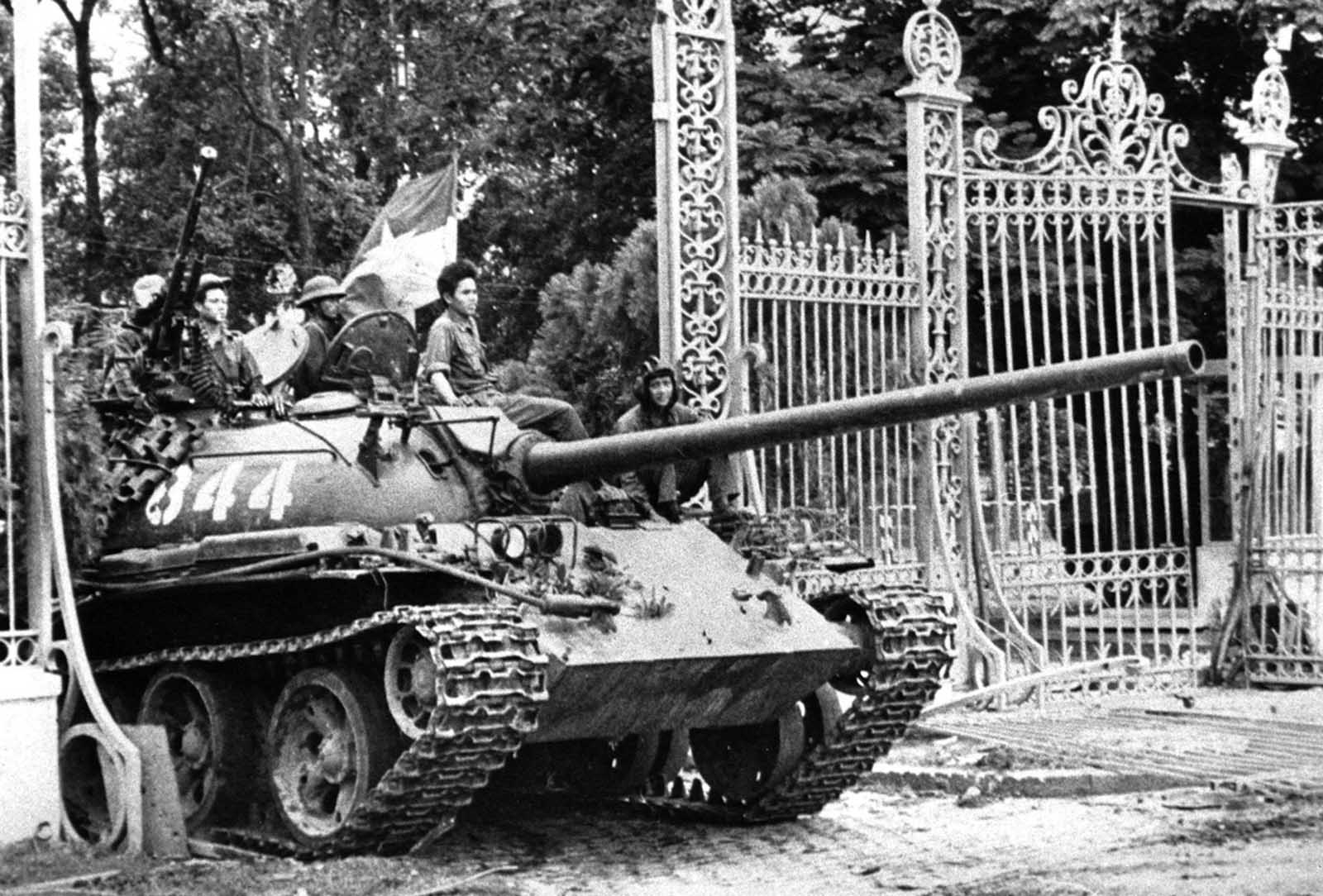 A North Vietnamese tank rolls through the gate of the Presidential Palace in Saigon, April 30, 1975, signifying the fall of South Vietnam. The Socialist Republic of Vietnam was formed in 1976, uniting North and South. Millions of South Vietnamese were sent to reeducation camps, millions more fled the country on their own, leading to the Indochina refugee crisis that lasted another quarter of a century.