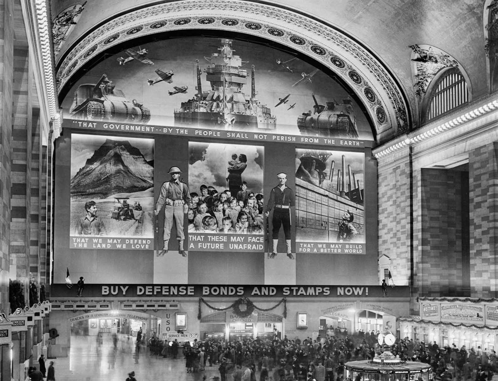 A massive photomural to promote the sale of defense bonds, designed by the Farm Security Administration, in the concourse of Grand Central Terminal, in 1941. 