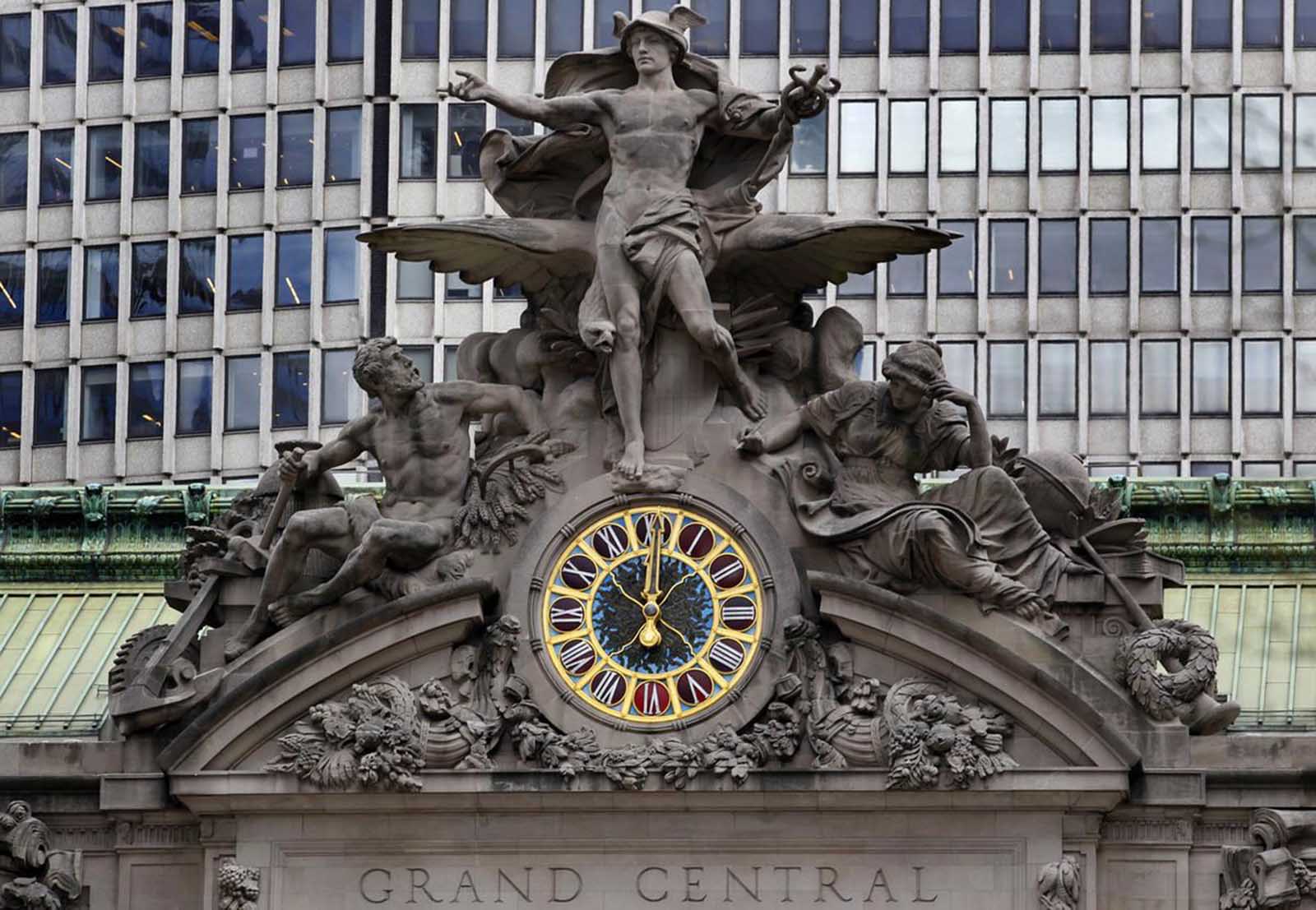 The clock on the south-facing side of New York's Grand Central Terminal strikes noon, on March 29, 2012.