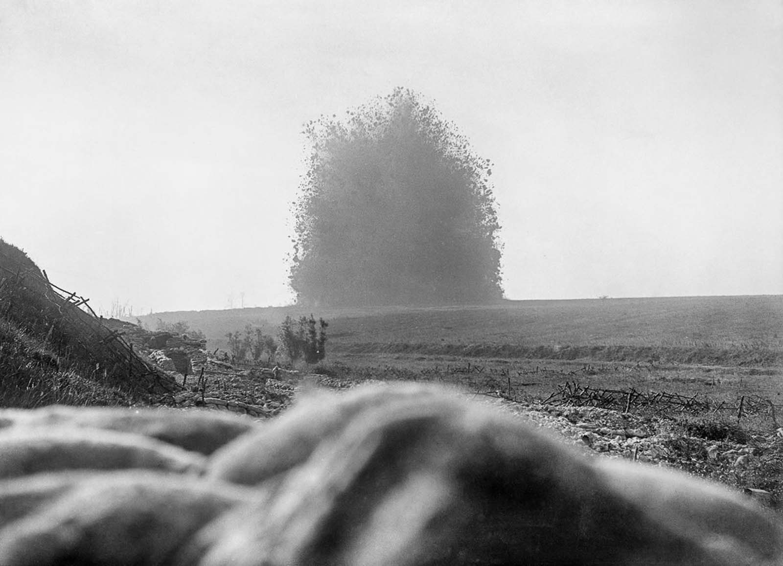 A 45,000-pound mine (2 ton) under the German front line positions at Hawthorn Redoubt is fired 10 minutes before the assault at Beaumont Hamel on the first day of the Battle of the Somme. The mine left a crater 130 feet (40 m) across and 58 feet (18 m) deep.