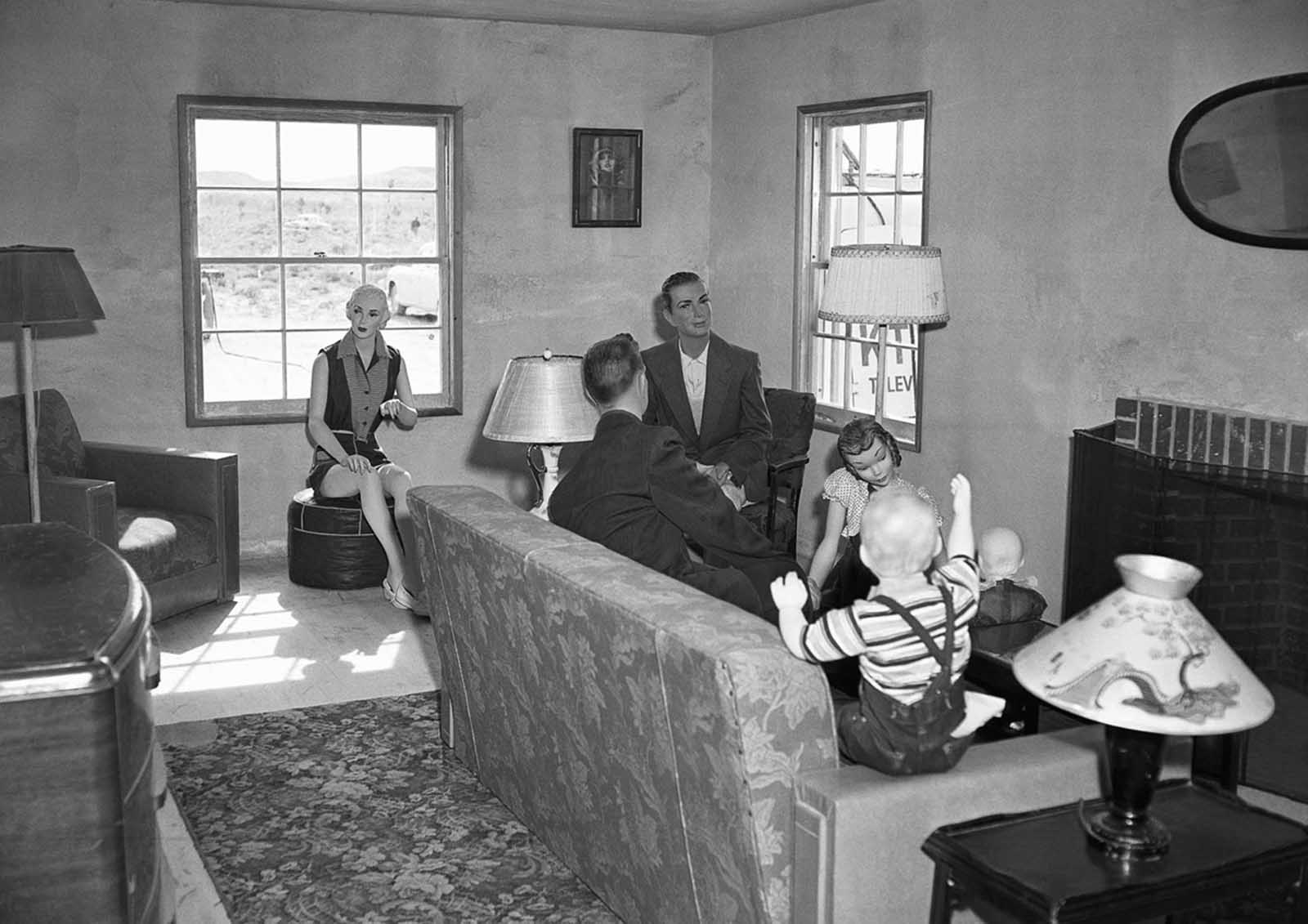 (1 of 2) Mannequins representing a typical American family gathered in a living room are pictured on March 15, 1953 in House No. 2, awaiting an atomic test explosion on the Nevada Proving Grounds.
