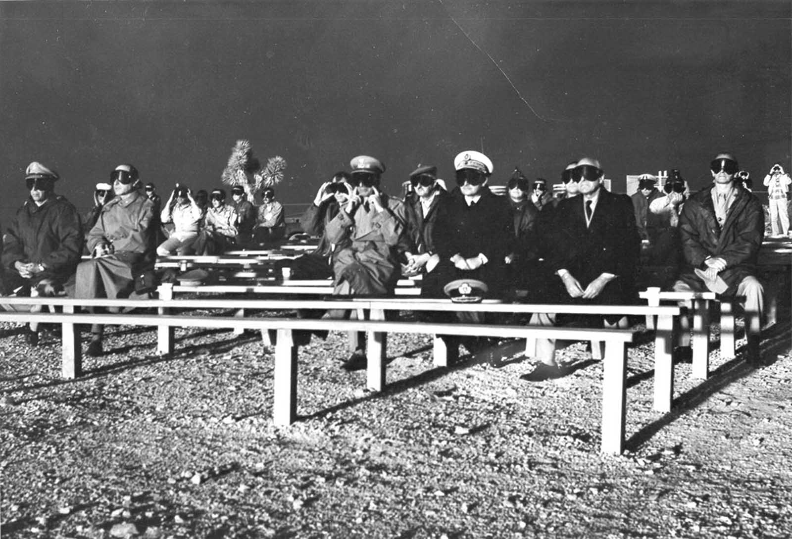 NATO observers watch the detonation of Operation Plumbbob Boltzmann on May 28, 1957.