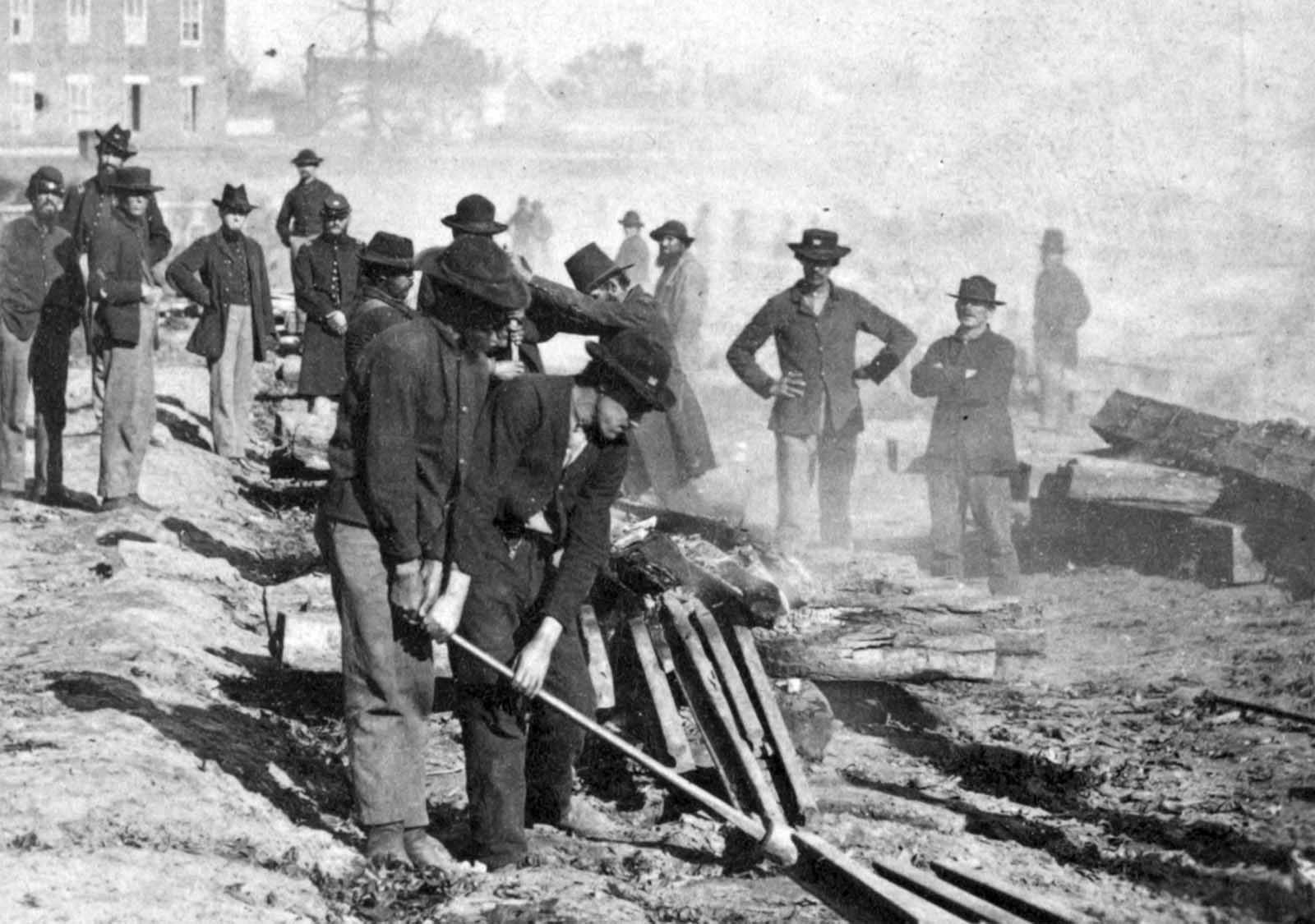 General Sherman's men destroying the railroad before the evacuation of Atlanta, Georgia in 1864.