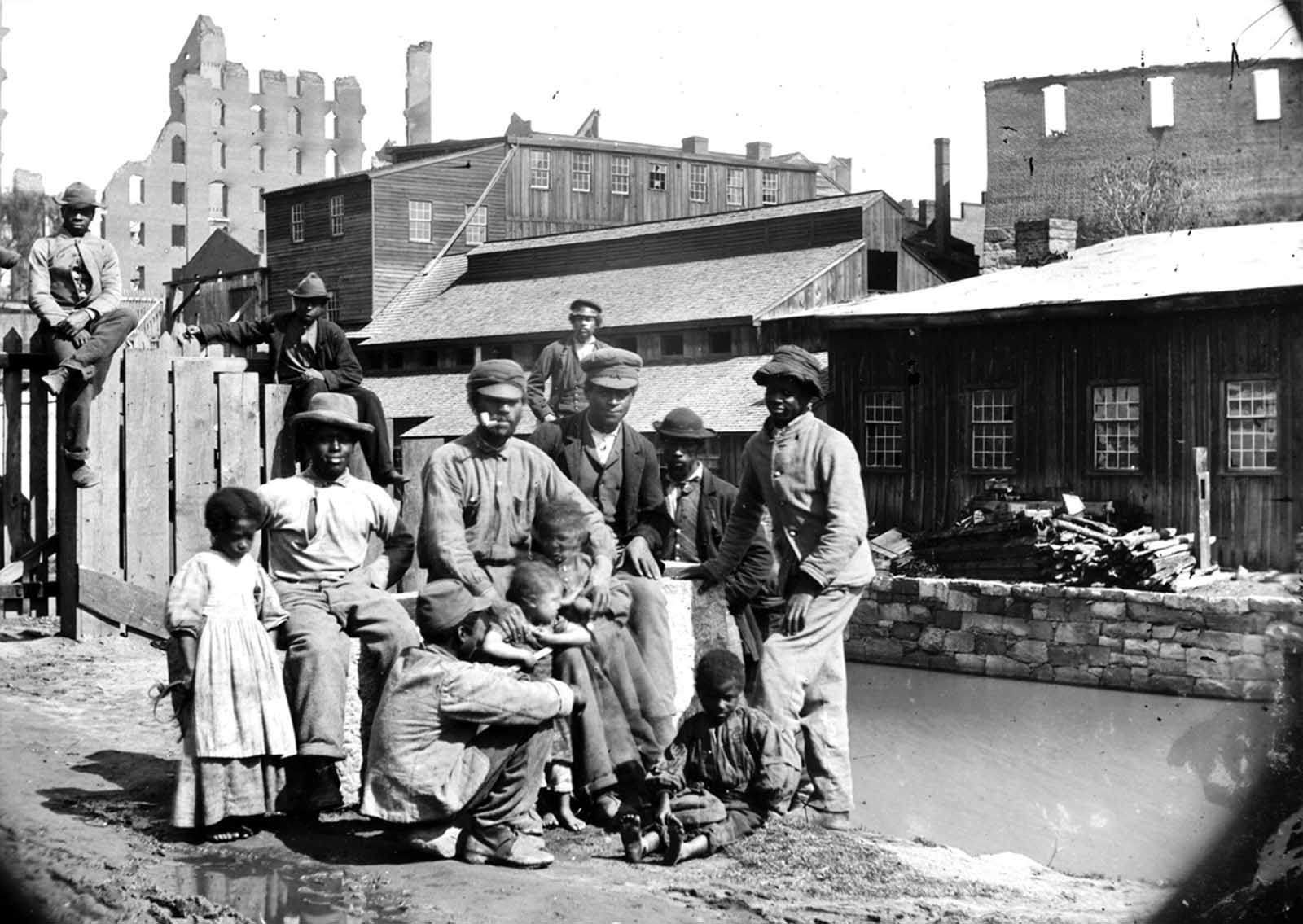 A group of Contrabands at Haxall's Mill, Richmond, Virginia, on June 9, 1865.