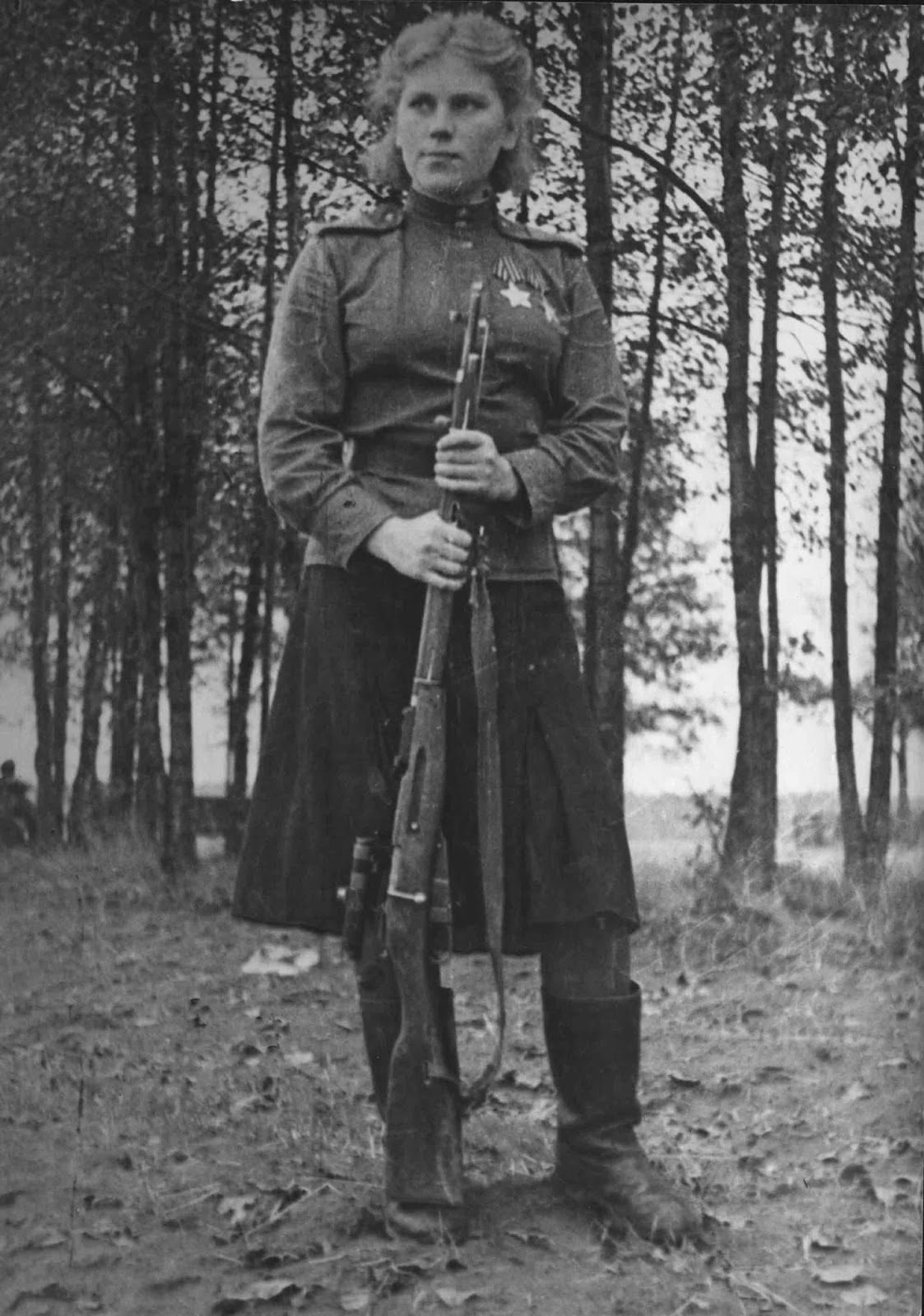 Shanina in November 1944, wearing a male-issue wool field shirt and woollen skirt. The shirt was khaki, while the skirt was dark blue.