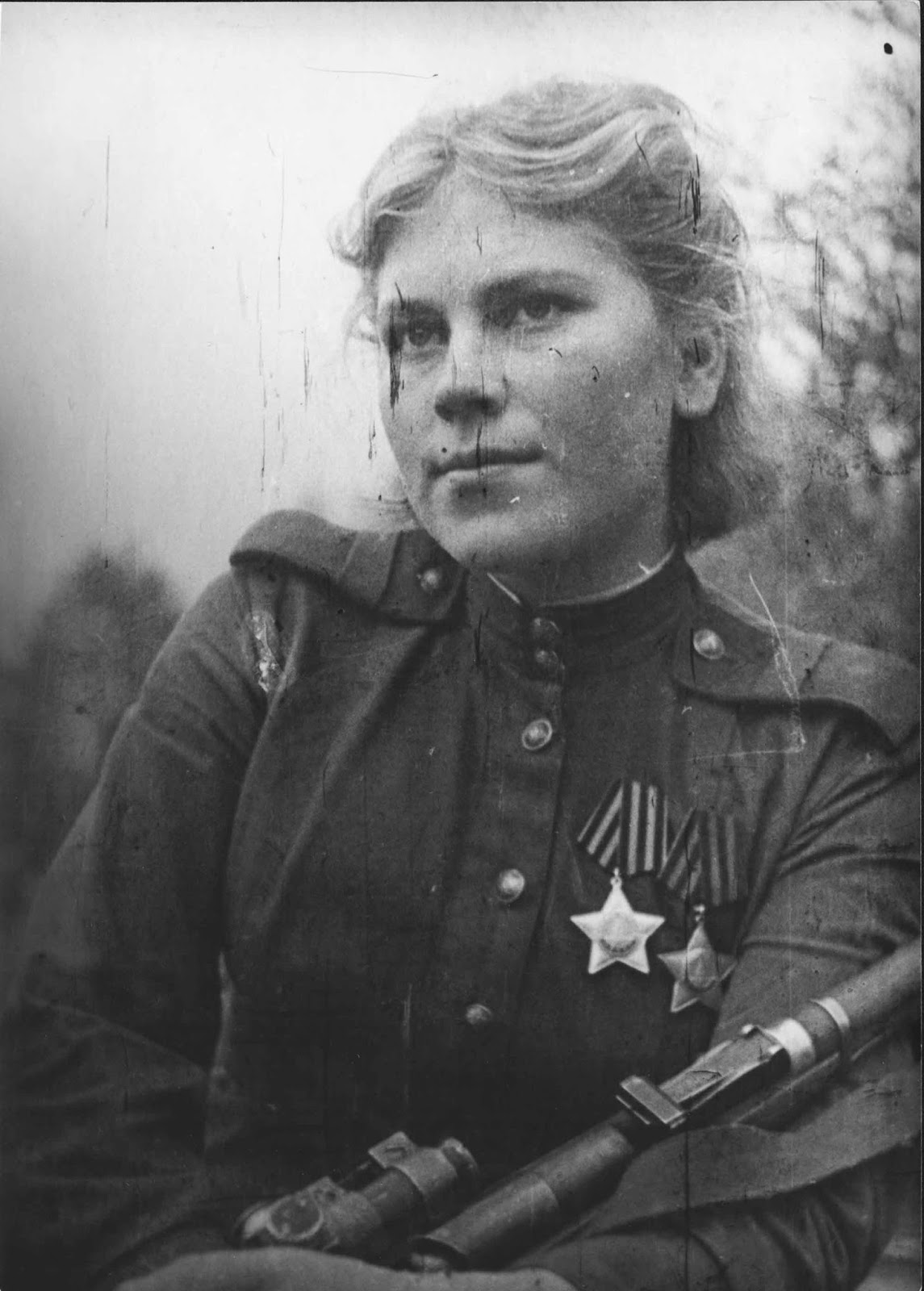 In December 1941, a death notification was received for her 19-year-old brother Mikhail, who had died during the Siege of Leningrad. In response, Shanina went to the military commissariat to ask for permission to serve.