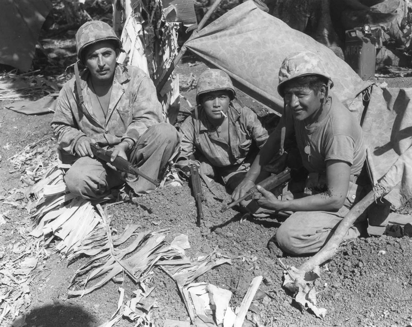 Corporal Oscar Ithma, Private First Class Jack Nez, and Private First Class Carl Gorman on Saipan.