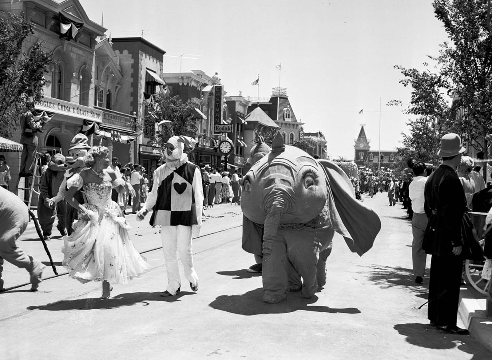 Dumbo and other characters from Disney movies appear in a parade down Main Street, U.S.A., at the Disneyland opening on July 17, 1955.
