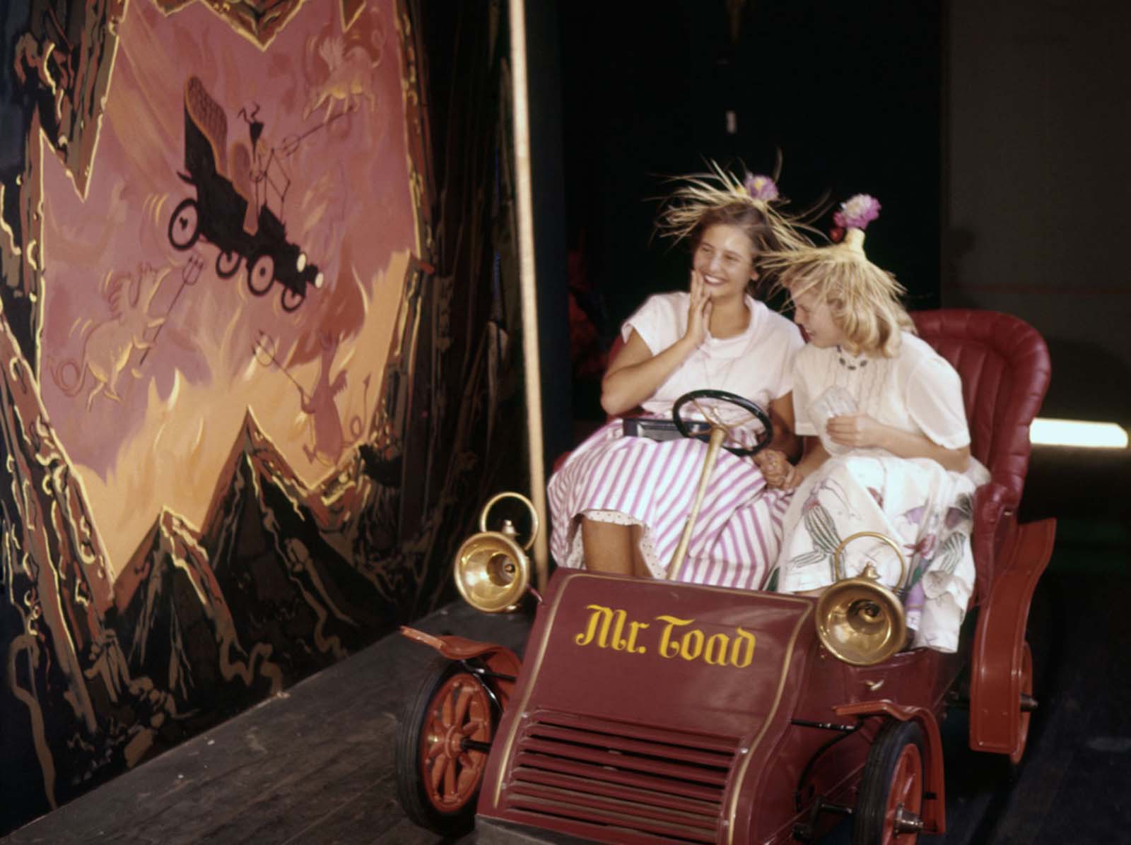 Visitors take a ride on Mr. Toad's Wild Ride at Disneyland on July 17, 1955.
