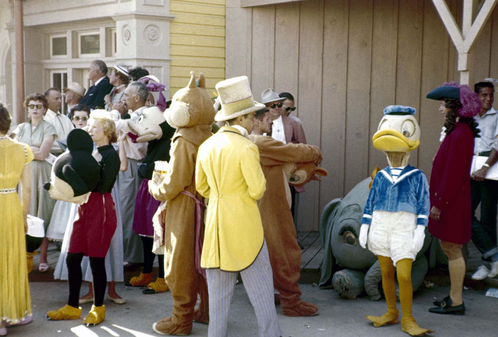 Parade participants and costumed Disney characters ready themselves for the televised grand opening of Disneyland on July 17, 1955.