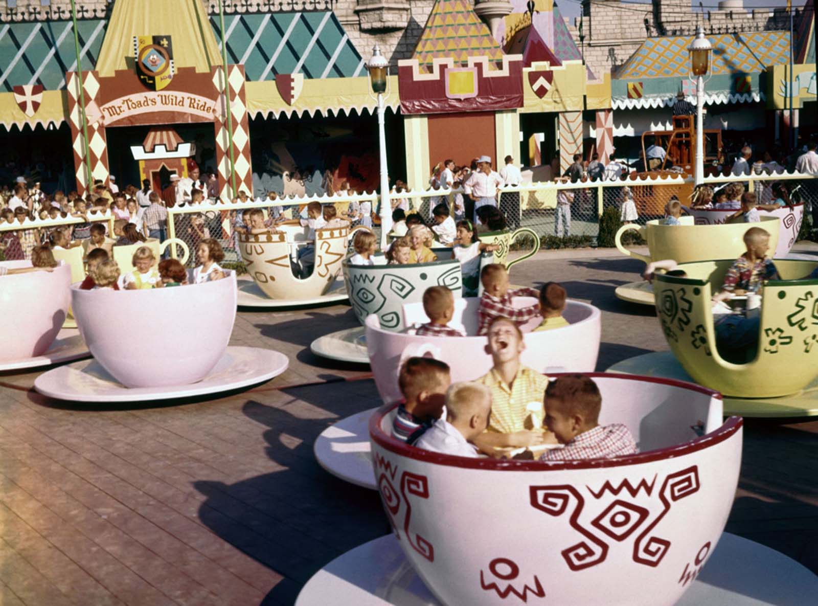 Visitors ride the Mad Hatter's Tea Party attraction in Fantasyland on July 17, 1955.
