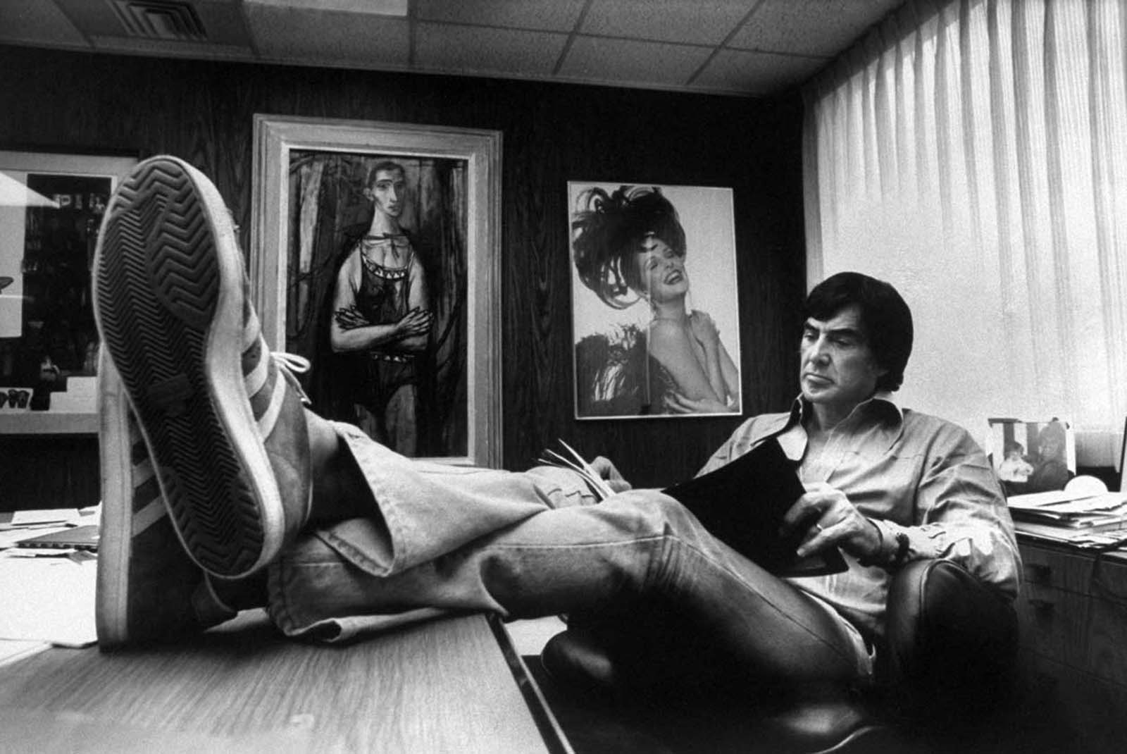 John DeLorean reading in his home office. 1974.