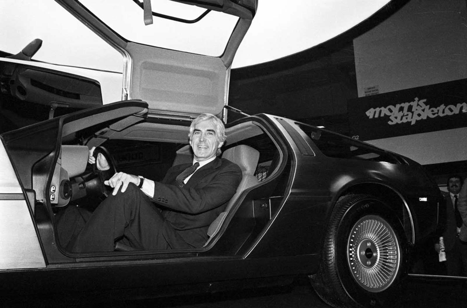 DeLorean sits in his car at the Earl’s Court Motor Fair, London. 1981.