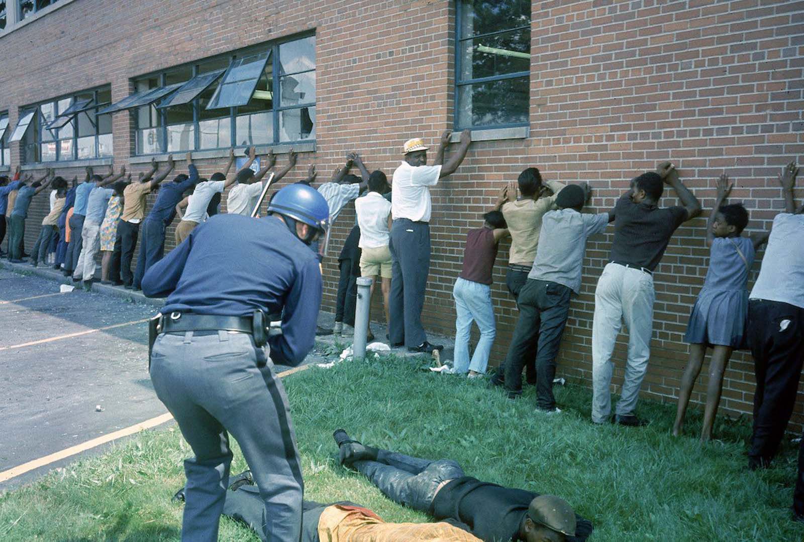 Police officer lining up suspects.