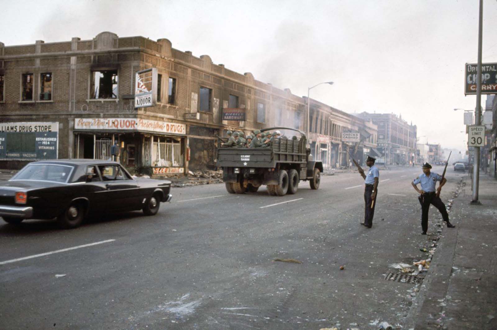 Detroit street with National Guard and police.