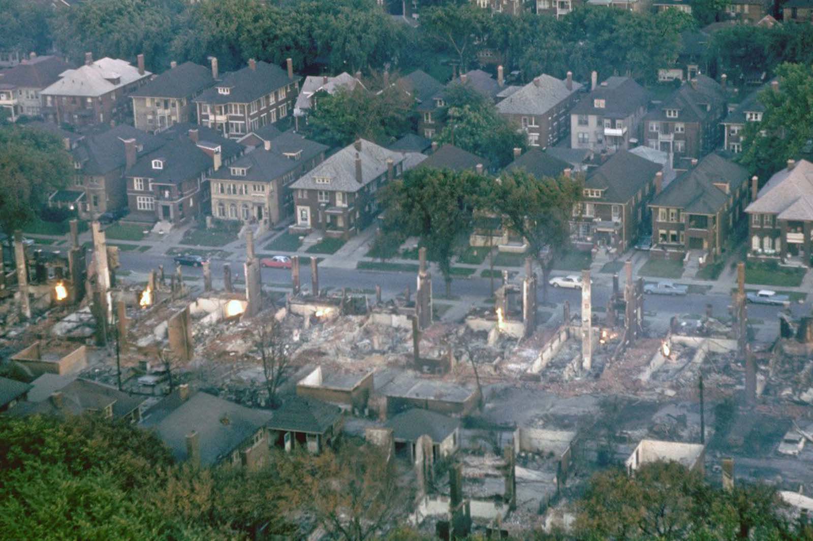 Smoldering ruins of a middle-class black neighborhood.