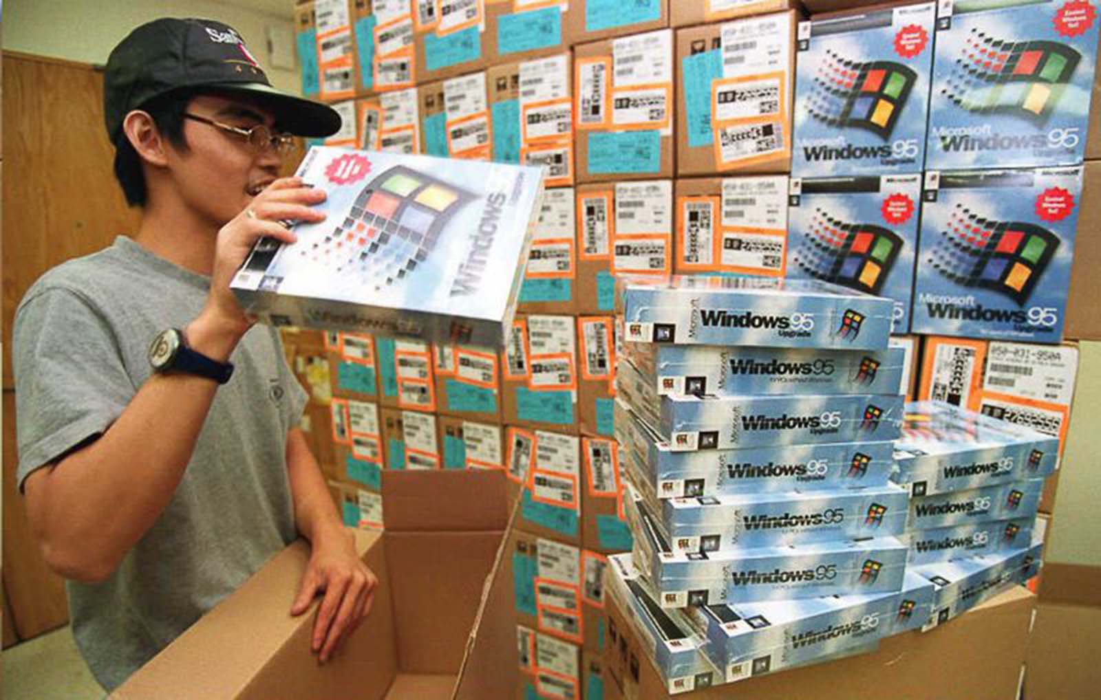 A wholesale distributor unpacks copies of Windows 95 in Hong Kong.