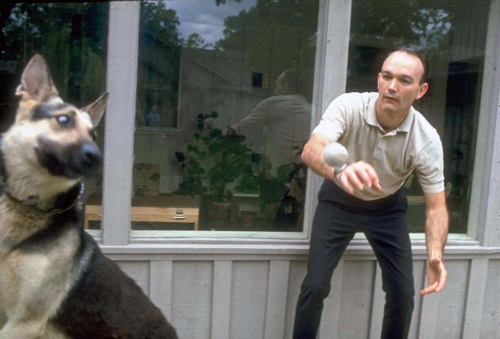 Apollo 11 Command Module Pilot Michael Collins enjoys some time with his dog.