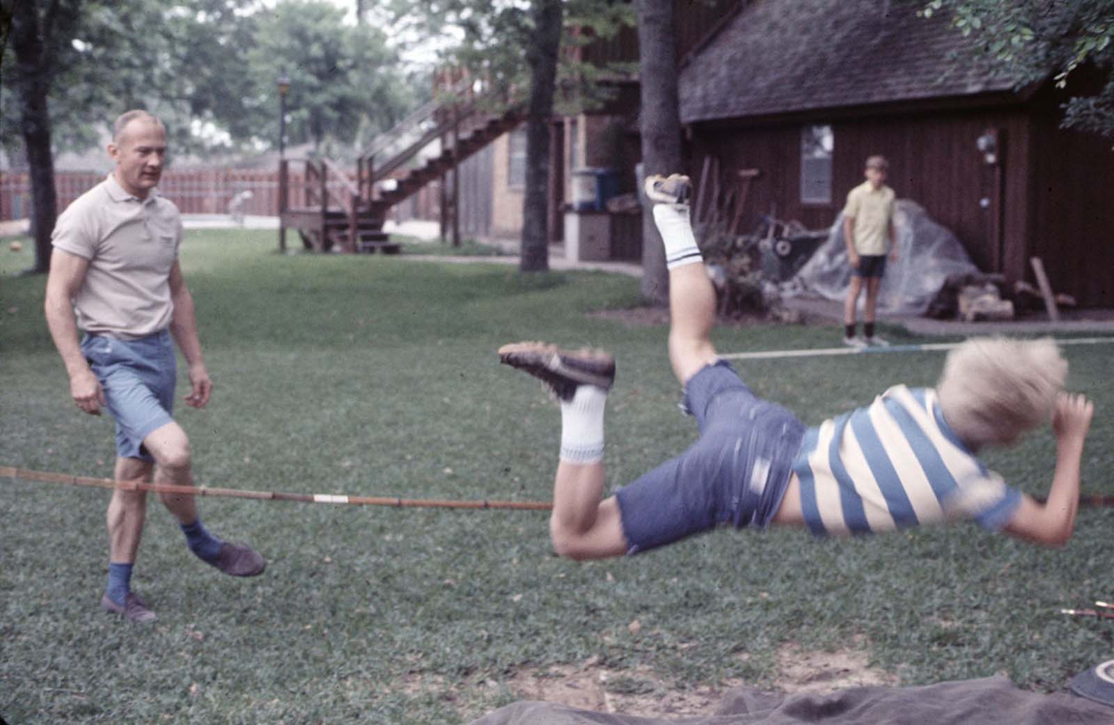 Buzz Aldrin and his sons practice pole vaulting at his Texas home.