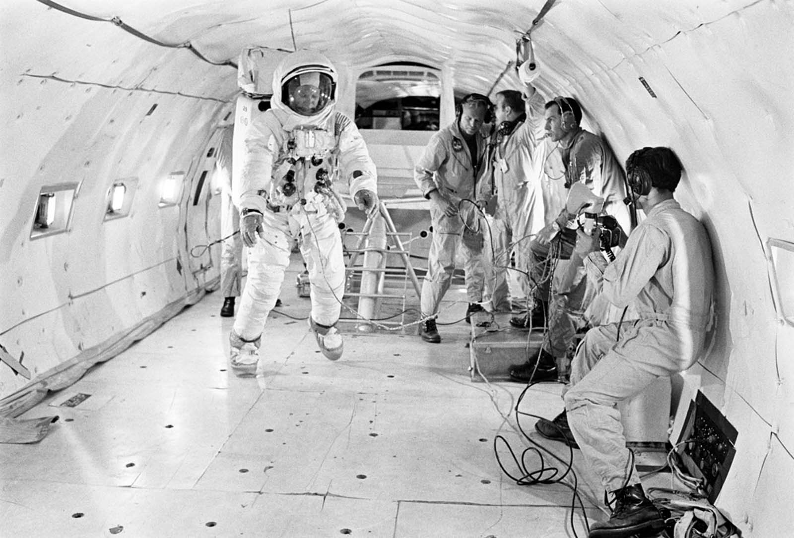 The astronaut Buzz Aldrin, fully suited, gets in more training time under partially weightless conditions aboard a KC-135 aircraft from the Wright-Patterson Air Force Base on July 9, 1969. The moon's gravity is about one-sixth that of Earth.