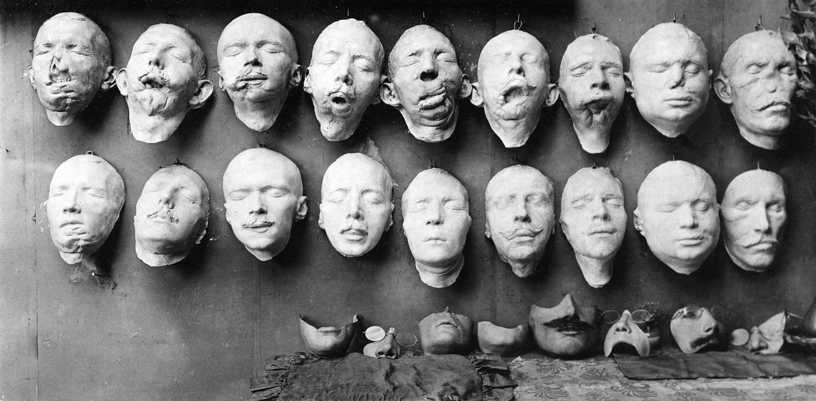 The top row of casts shows the first step in the process as these were molded from the soldiers’ disfigured faces.The bottom row of casts shows the molds with restorative work sculpted by Anna Coleman Ladd.