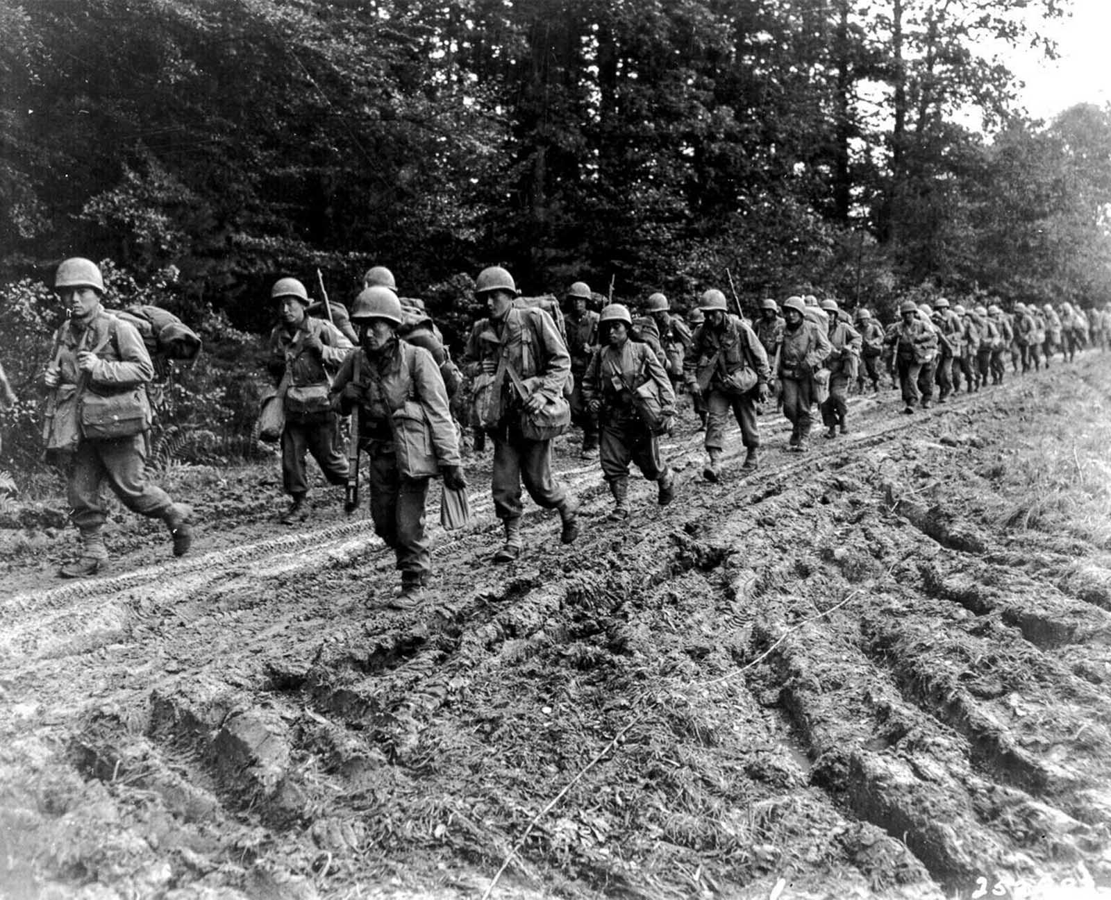 Members of the 442nd on the march in the Chambois Sector, France. 1944.