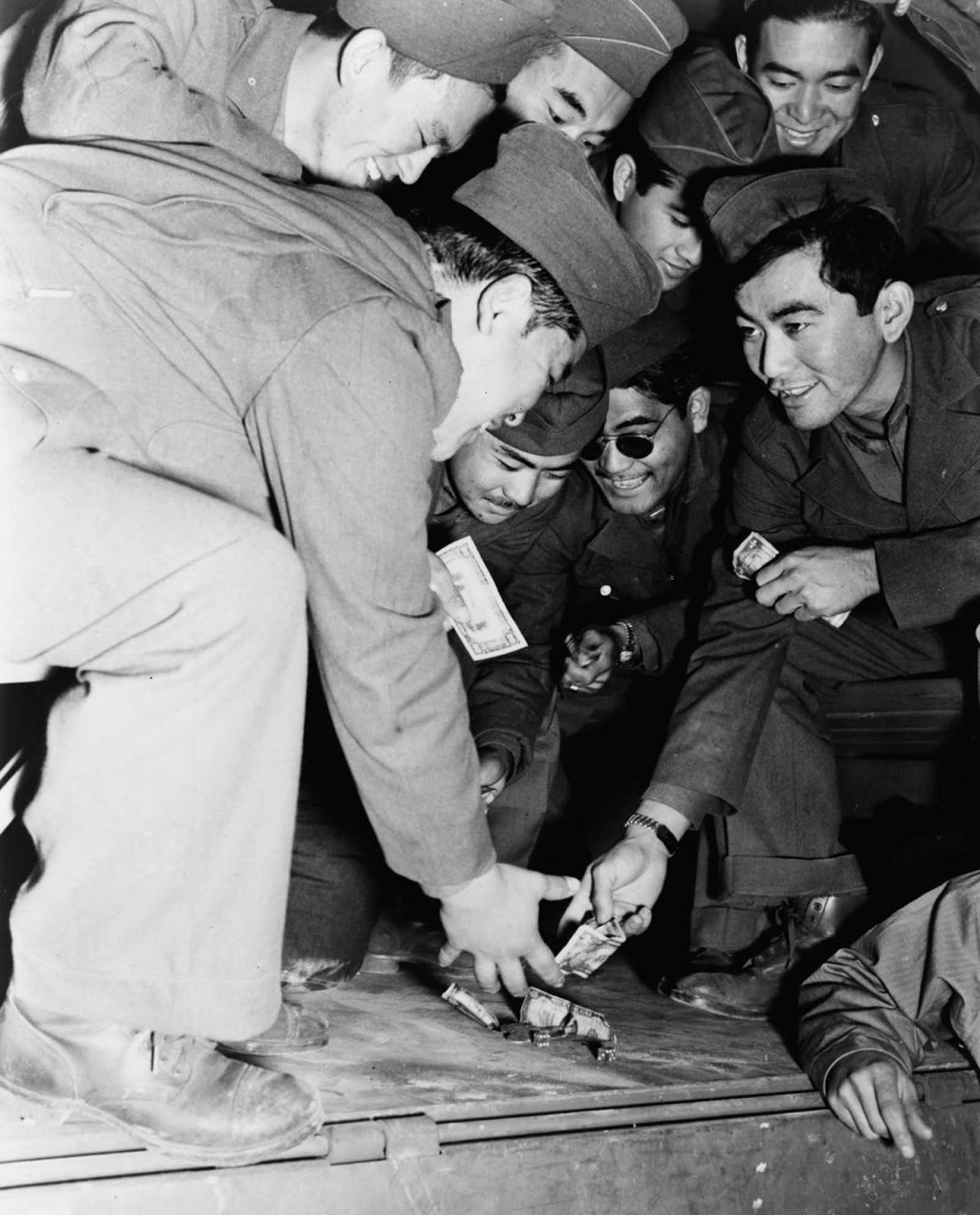 Soldiers of the 442nd kill time at Camp Shelby, Mississippi. June, 1943.