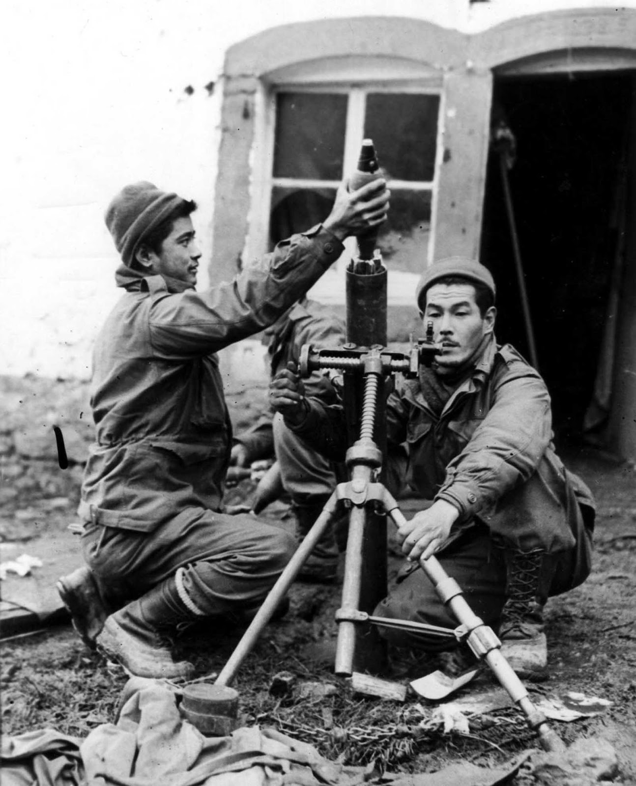 Soldiers fire mortar shells at German troops in France. Oct. 1, 1944.