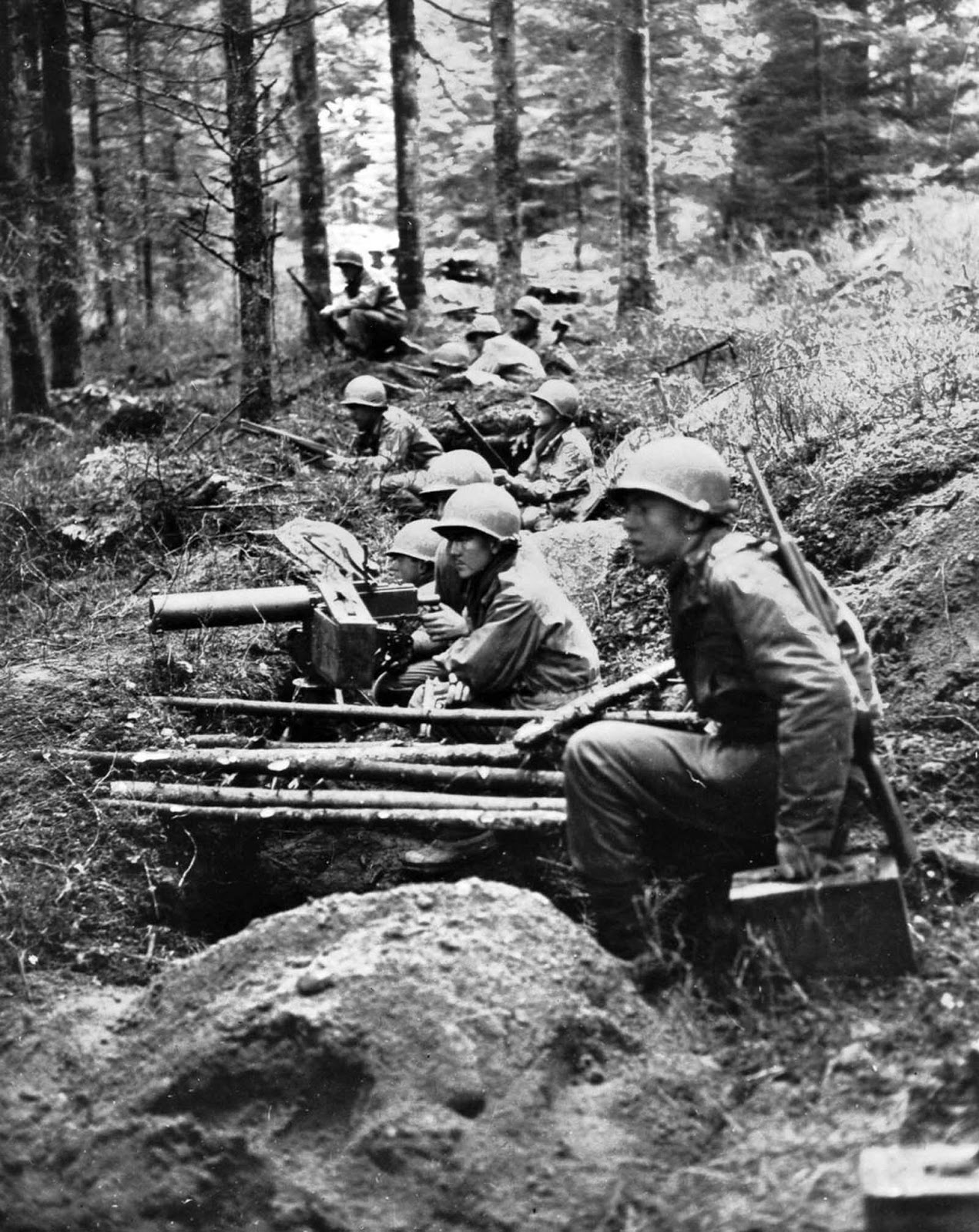 Soldiers man a machine gun nest in eastern France. Sept. 1, 1944.
