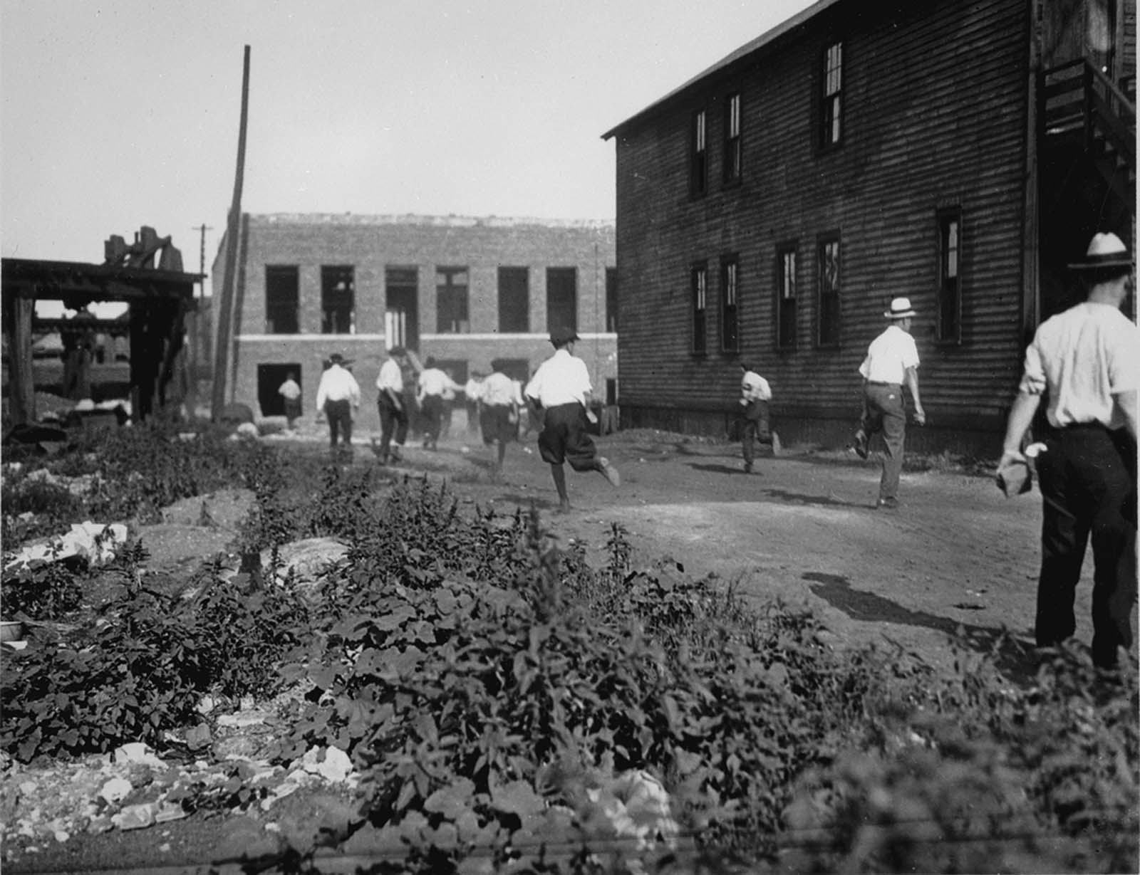 Mob chasing victims during the race riots.
