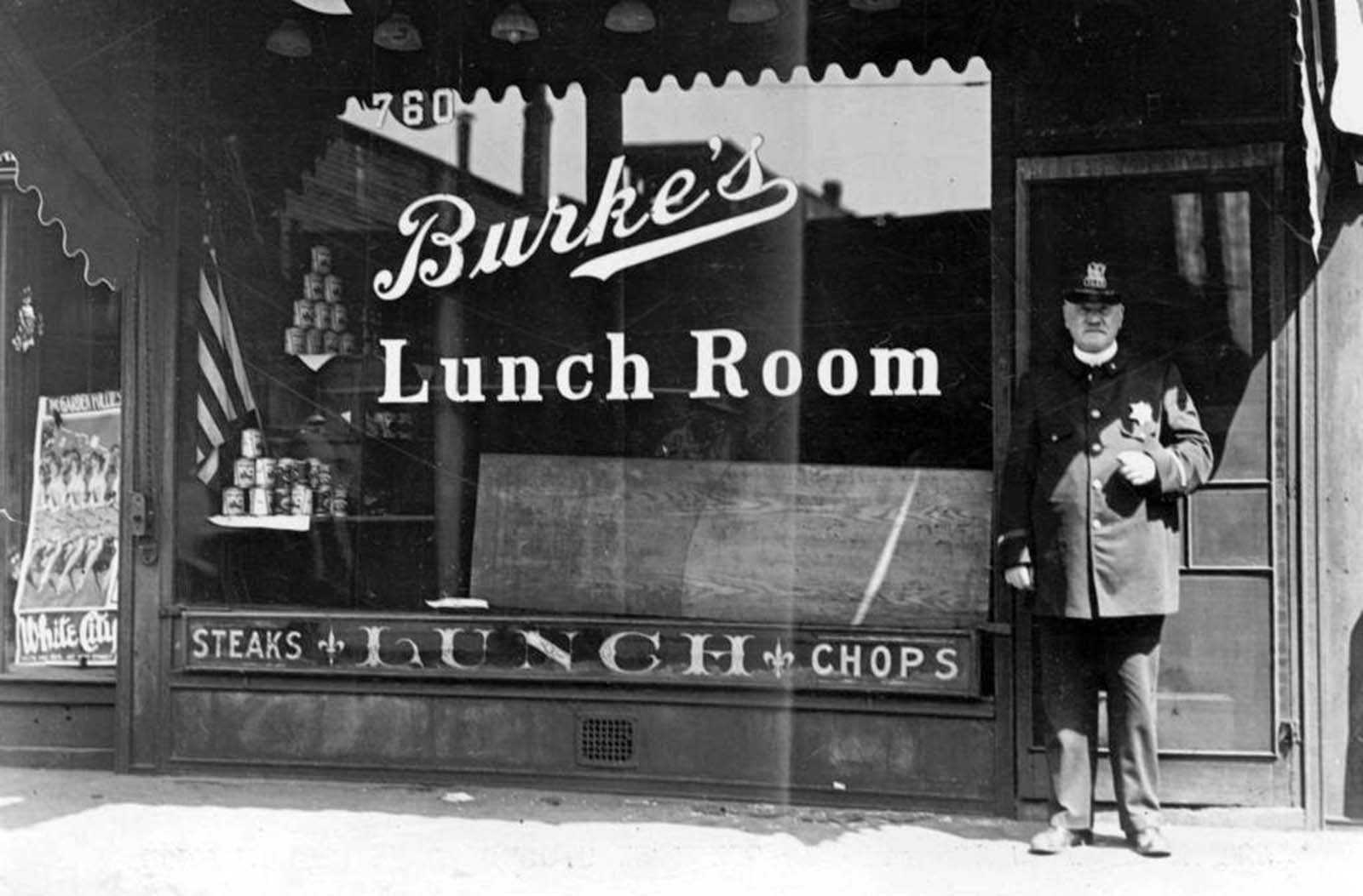 A police officer stands in front of Burke’s Lunch Room in the heart of Chicago’s business district July 30, 1919.