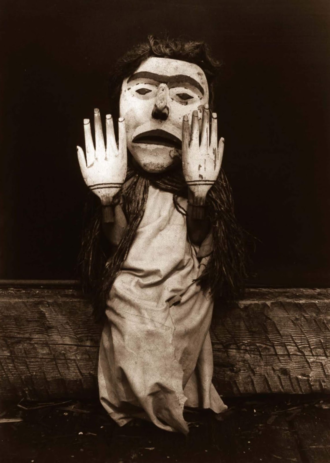 A Kwakiutl person dressed as a forest spirit, Nuhlimkilaka, (