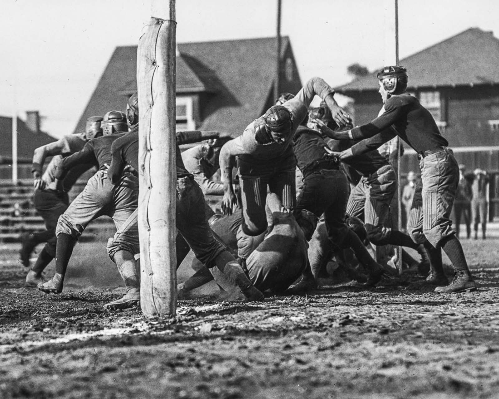 The University of Southern California Trojans football team compete against the Los Angeles High School Romans at the Los Angeles Memorial Coliseum. 1915.