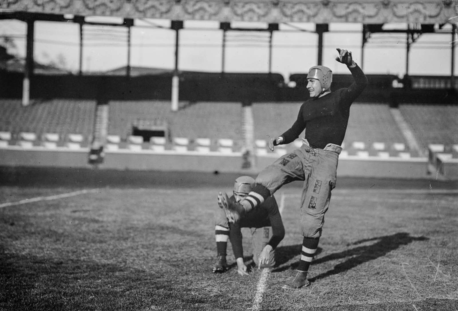 Brown University players compete in a game against Cornell University. 1914.