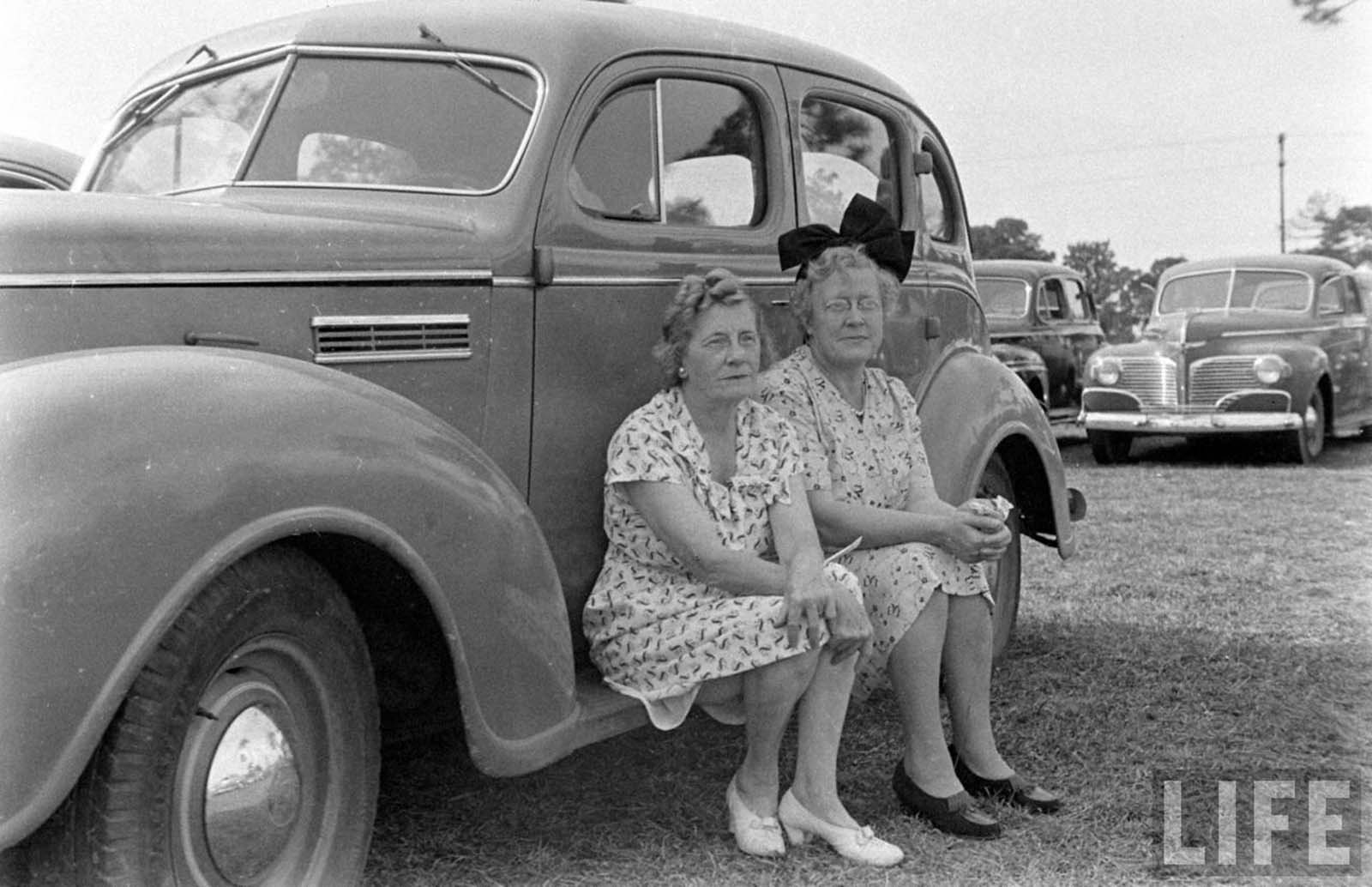 Two ladies praying (or not).