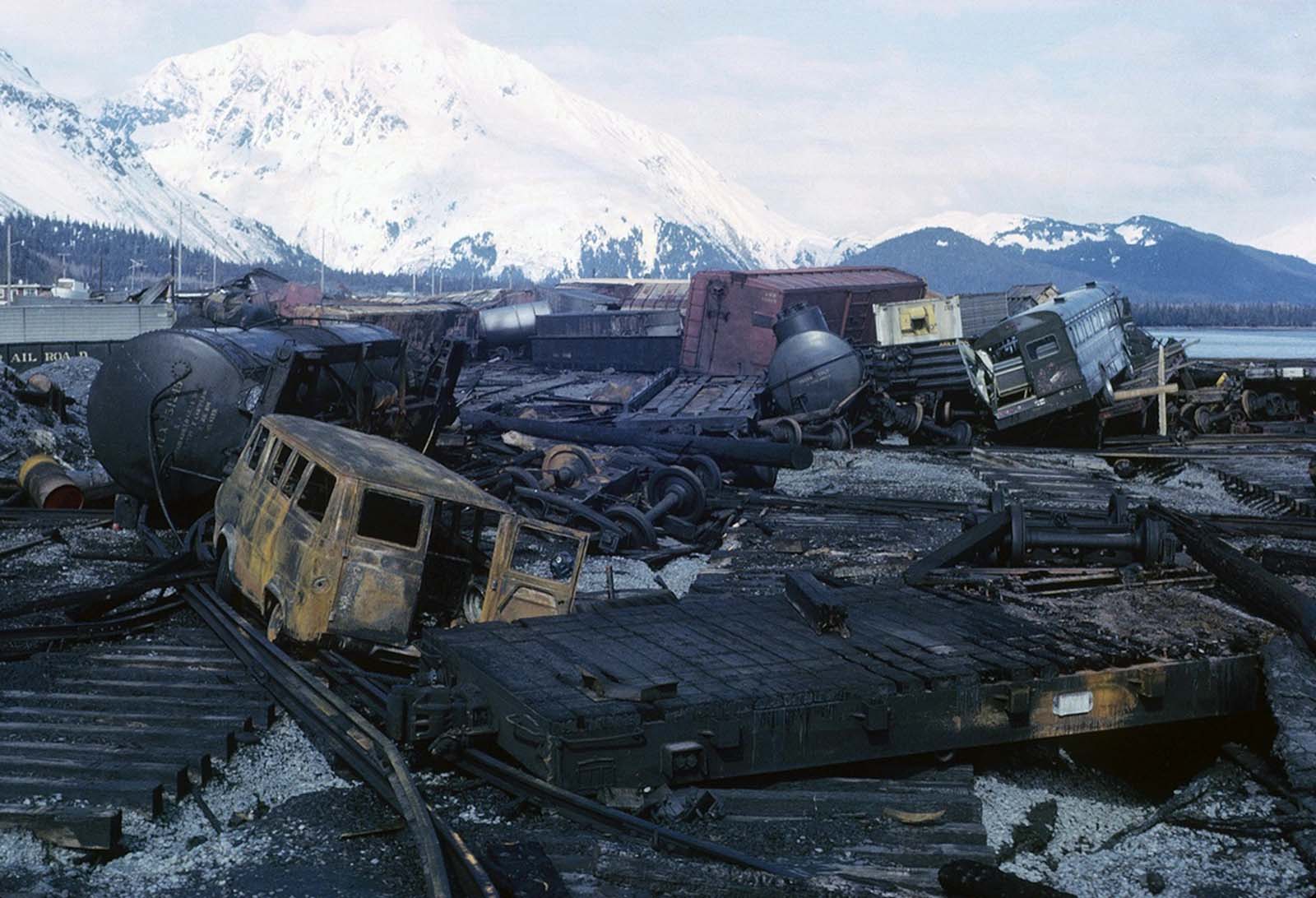 Chaos on the waterfront in Seward, burned-out vehicles and rail cars strewn across the ruined rail yard.
